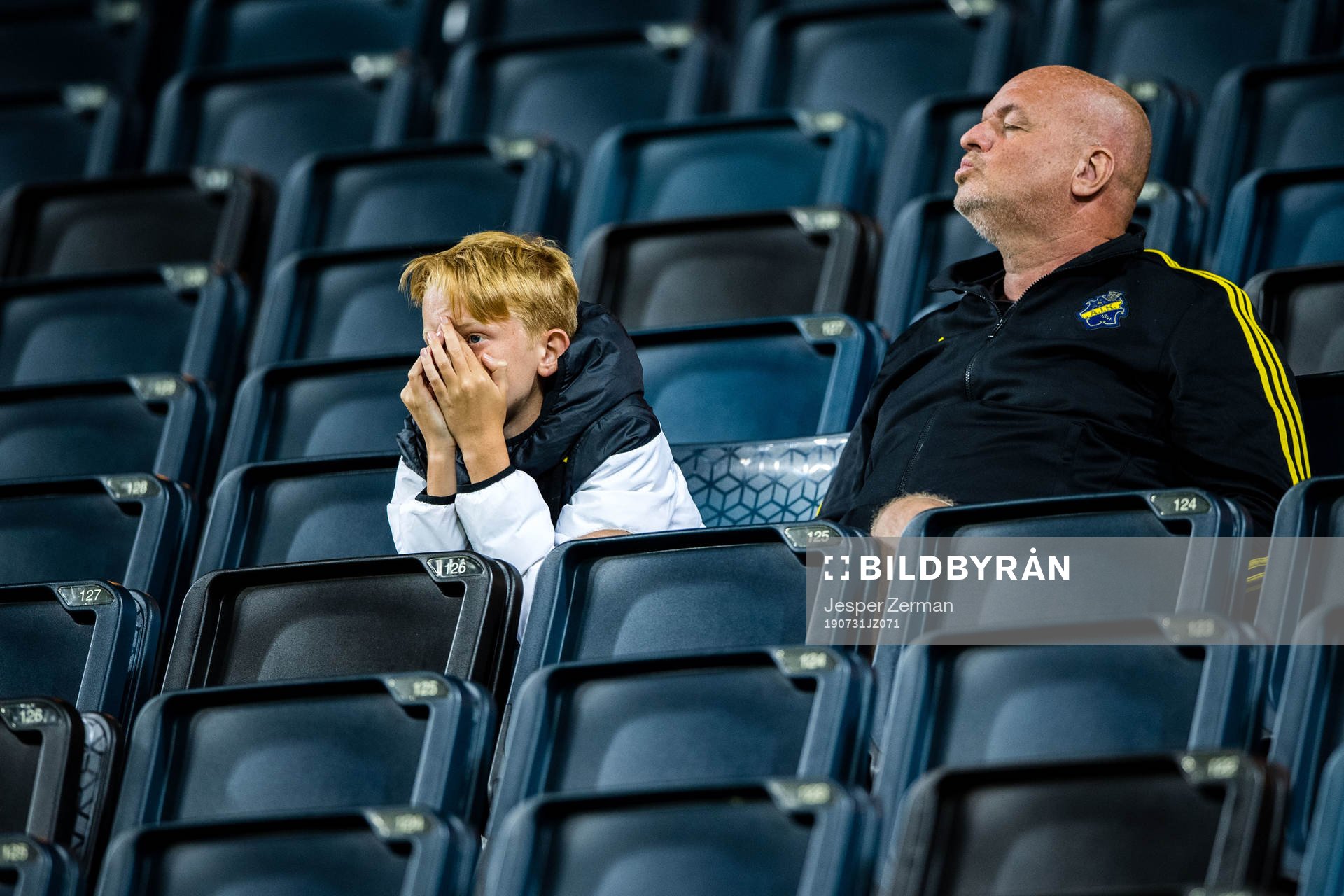 Fans of AIK looks dejected in the stands