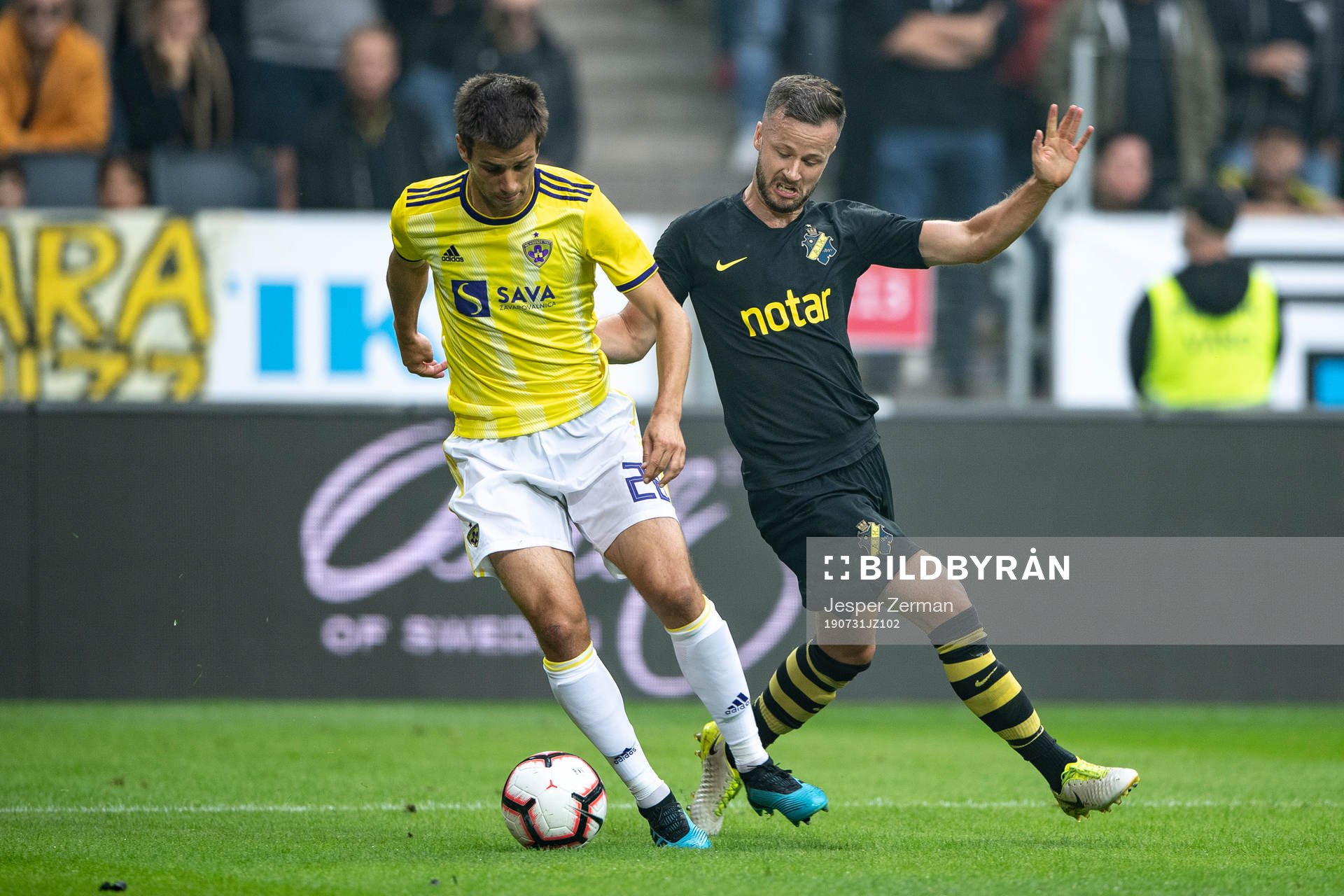 Mitja Viler of Maribor and Robert Lundström of AIK during the UEFA Champions League qualifying match between AIK and Maribor on July 31, 2019 in Stockholm.