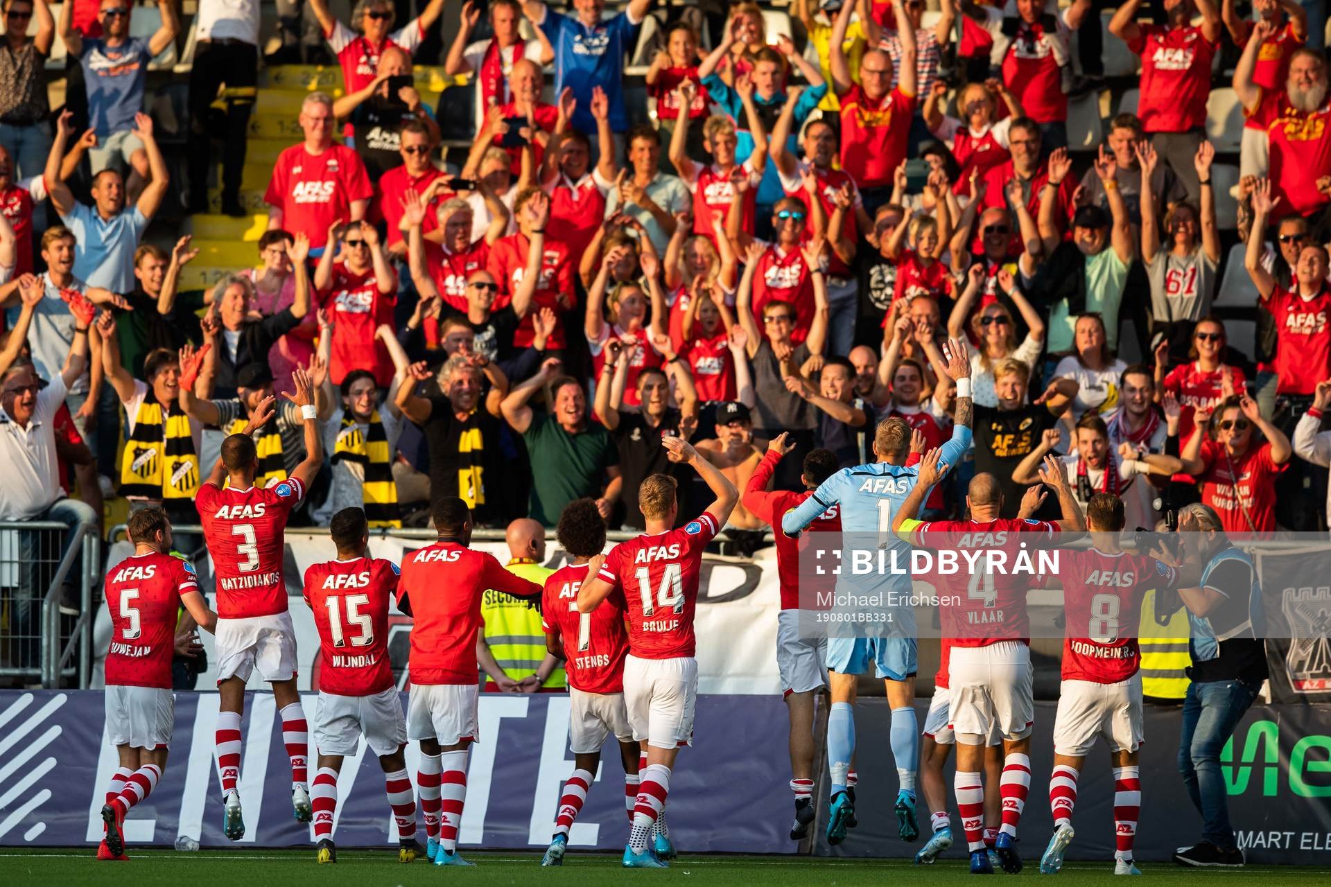 Players of AZ Alkmaar celebrate with supporters