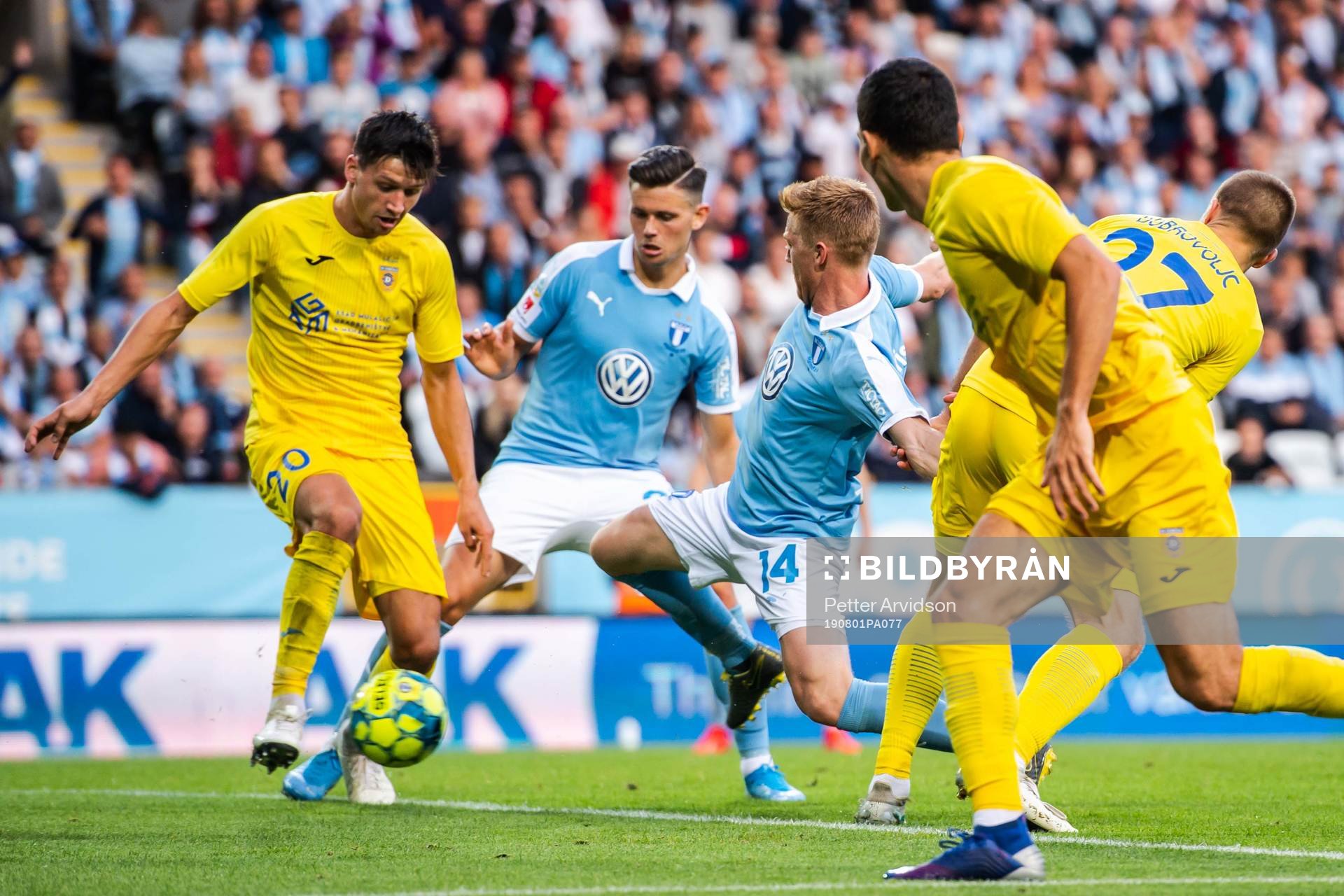 Anders Christiansen of Malmö FF and Sven Karic of Domzale