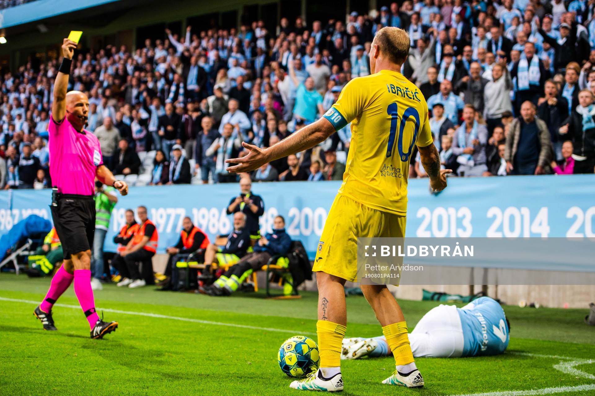 Senijad Ibricic of Domzale receives a varning from referee