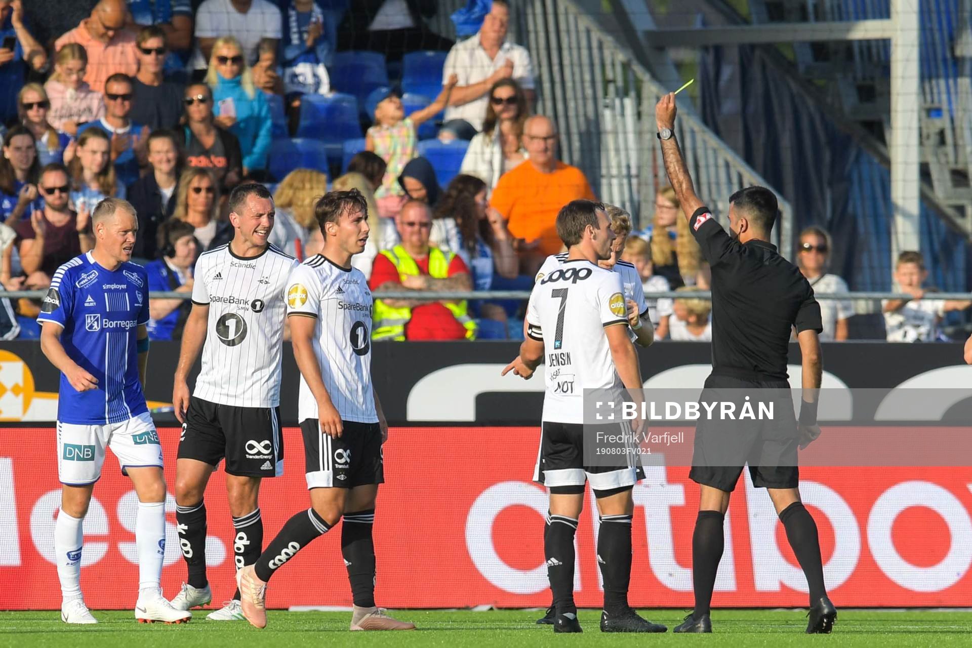 Anders Trondsen of Rosenborg receives a yellow card from