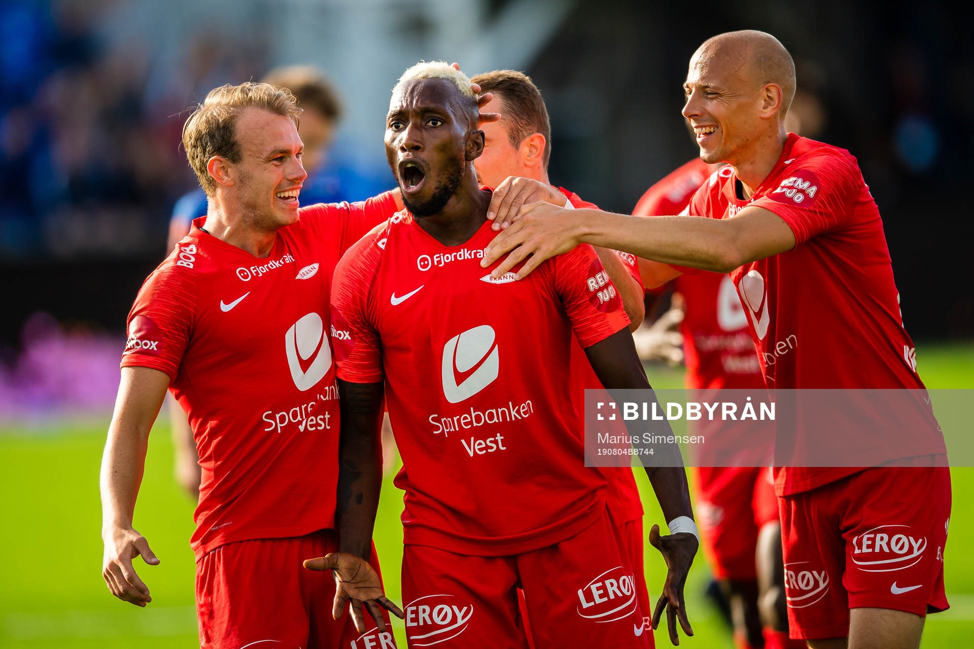 Karamoko Daouda Bamba of Brann celebrates after scoring the 0-1 goal with Petter Dahle Strand and Ruben Kristiansen of Brann during the Eliteserien match between Ranheim and Brann on August 4, 2019 in Trondheim.