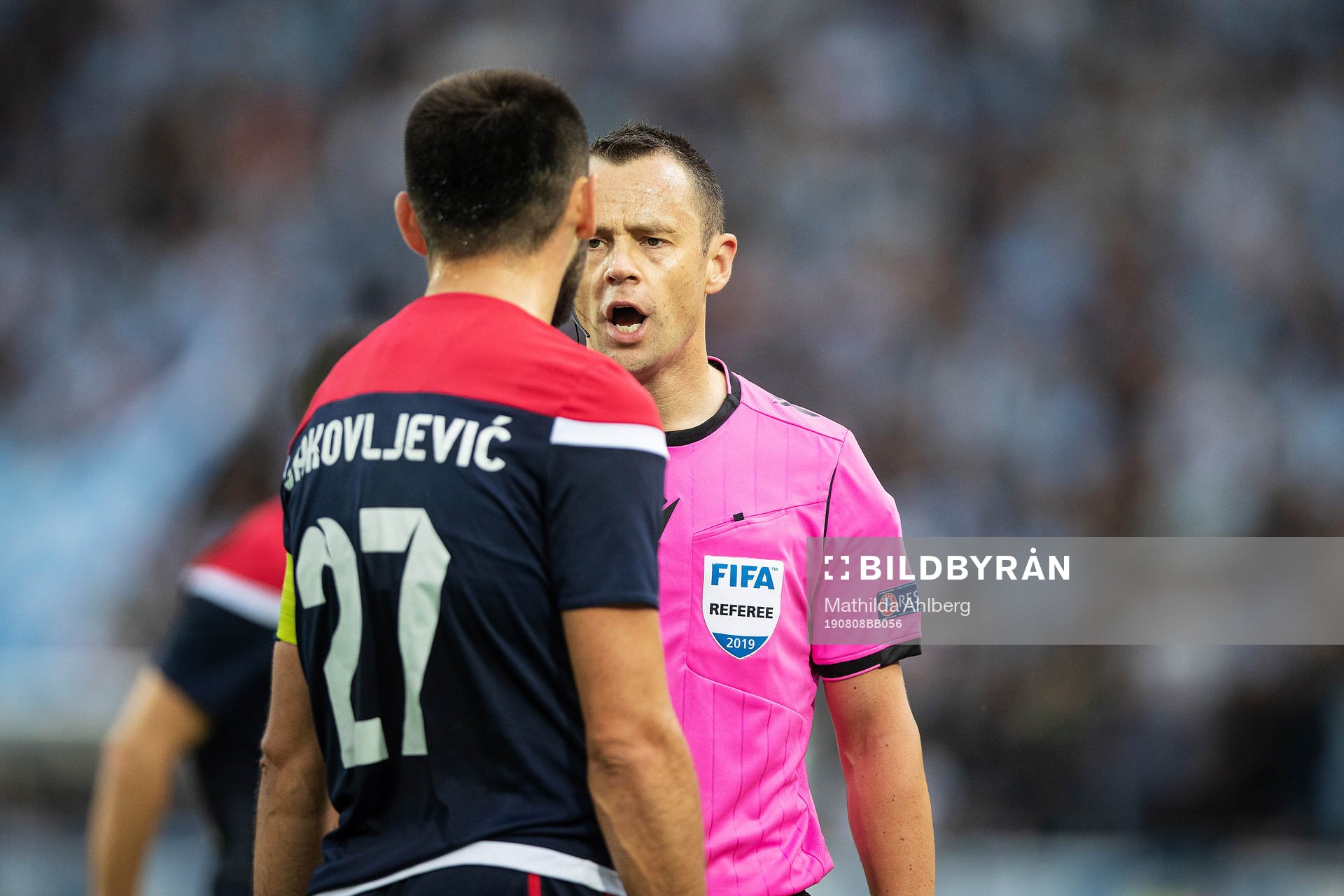 referee Stuart Attwell in discussion with Slobodan