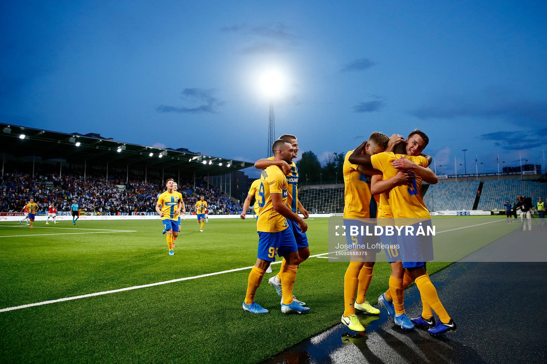 Simon Skrabb and Christoffer Nyman celebrate and hug Maic