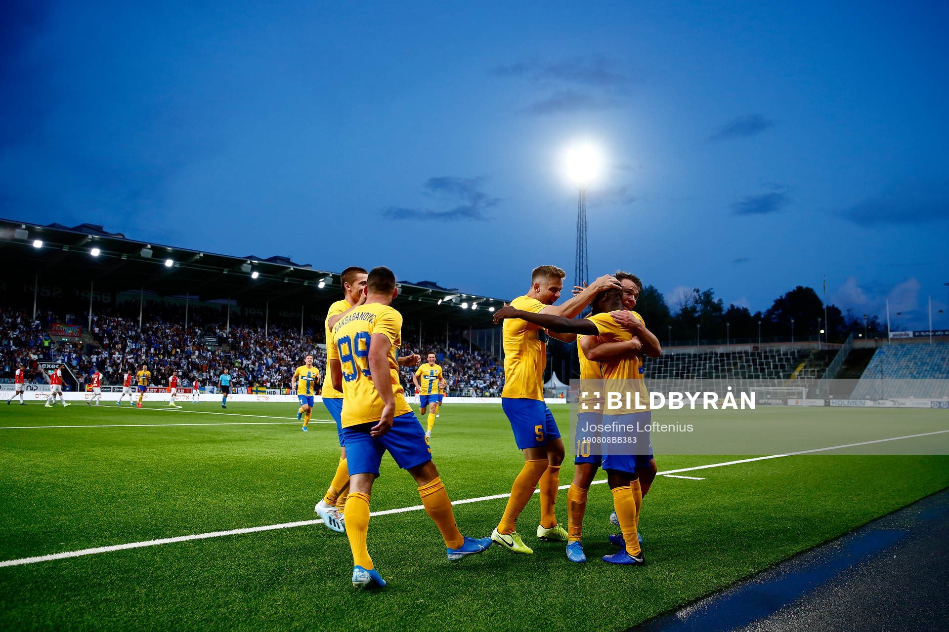 Simon Skrabb and Christoffer Nyman celebrate and hug Maic