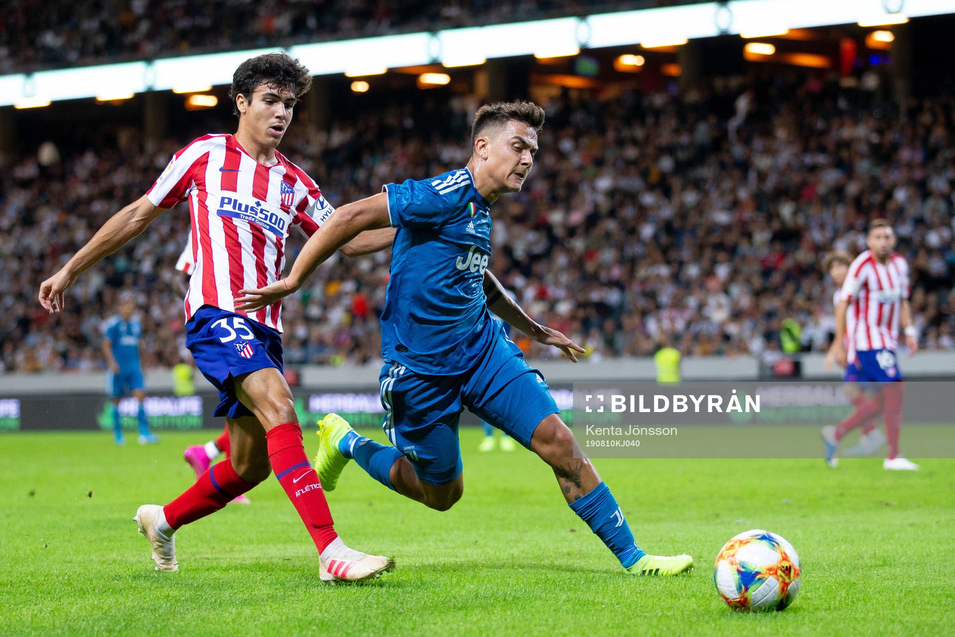 Manuel Sanchez of Atletico Madrid and Paulo Dybala of