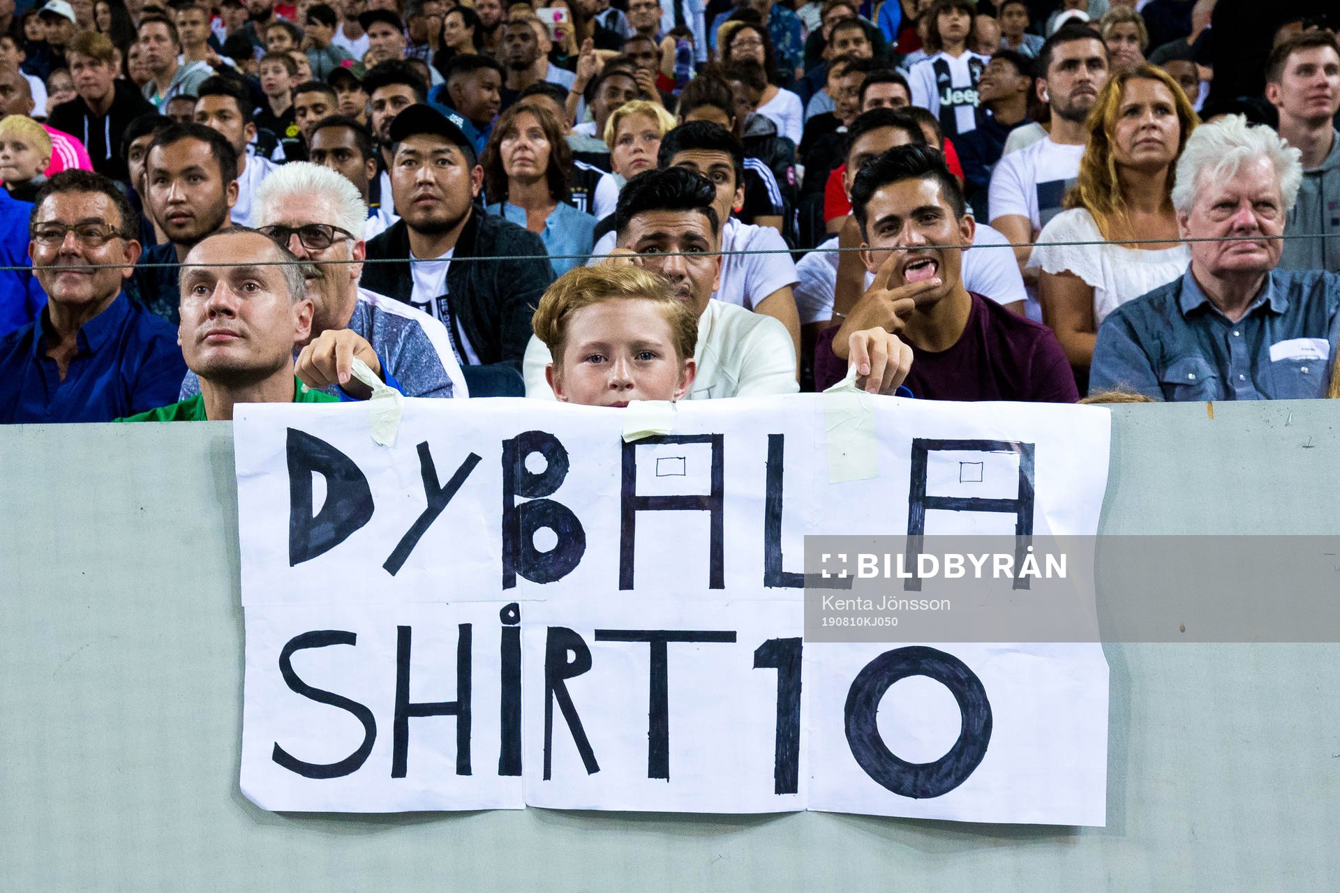 Supporters of Juventus with a sign as a message to Paulo