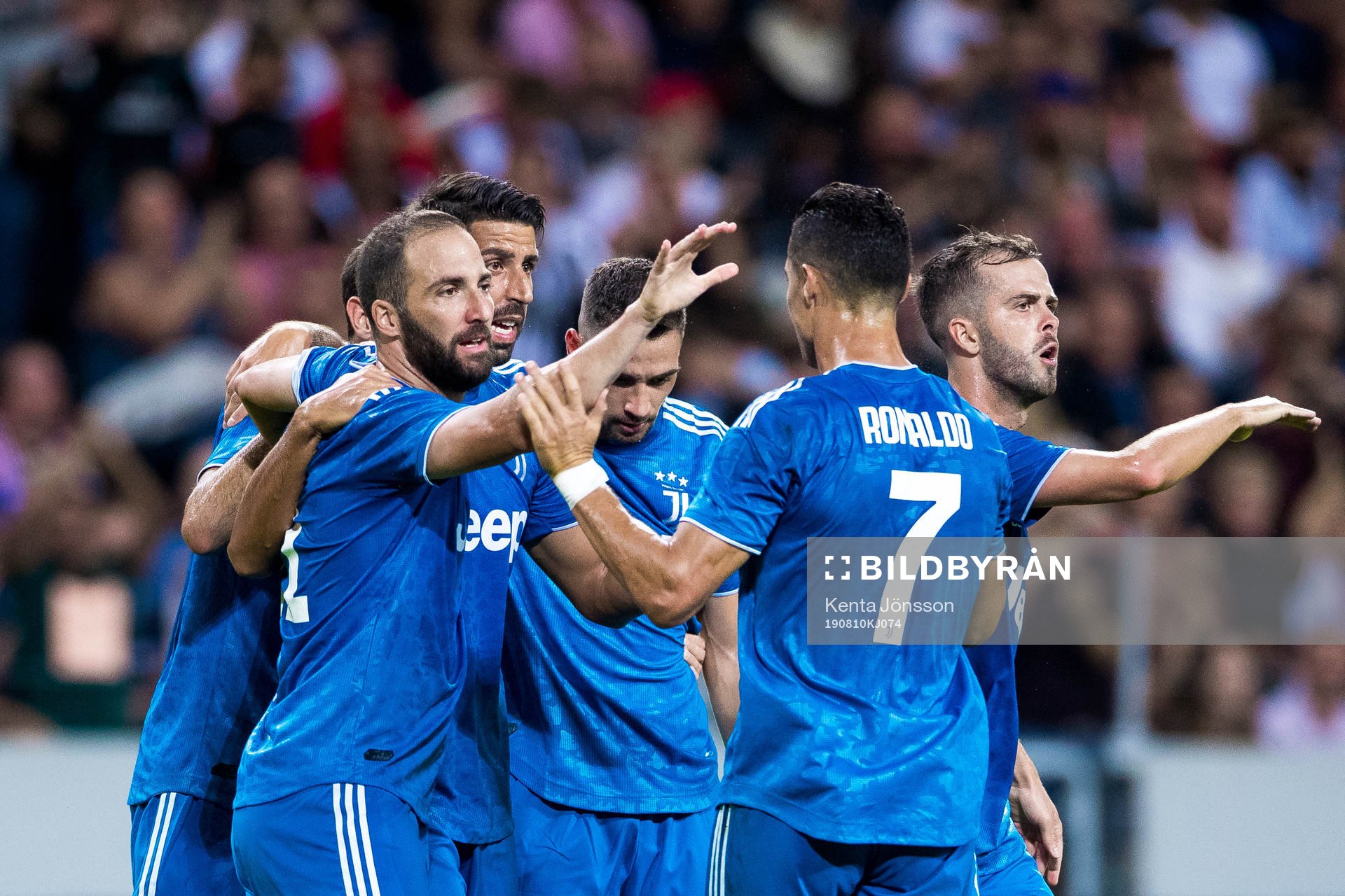 Sami Khedira of Juventus celebrates with teammates after 1-1 during the International Champions Cup match between Atletico Madrid and Juventus on August 10, 2019 in Stockholm.