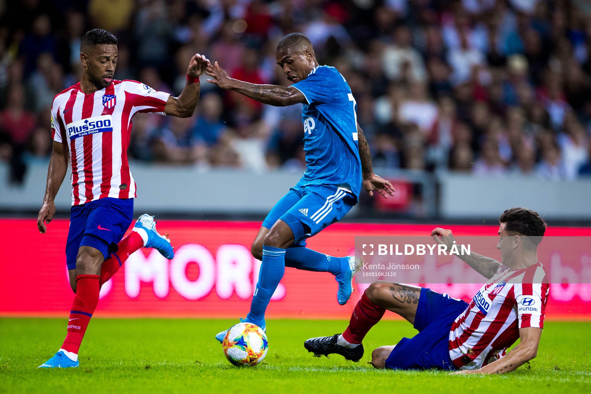 Renan Lodi of Atletico Madrid and Douglas Costa of Juventus