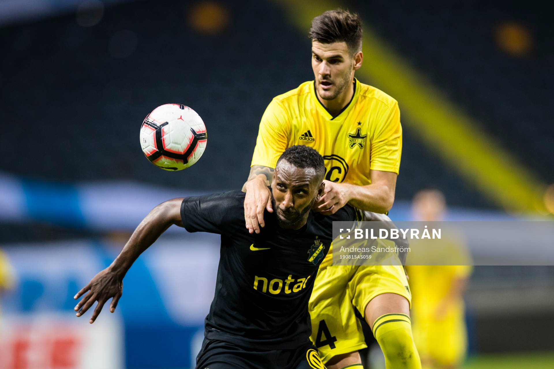 Henok Goitom of AIK battles for the ball with Andrej Lukic