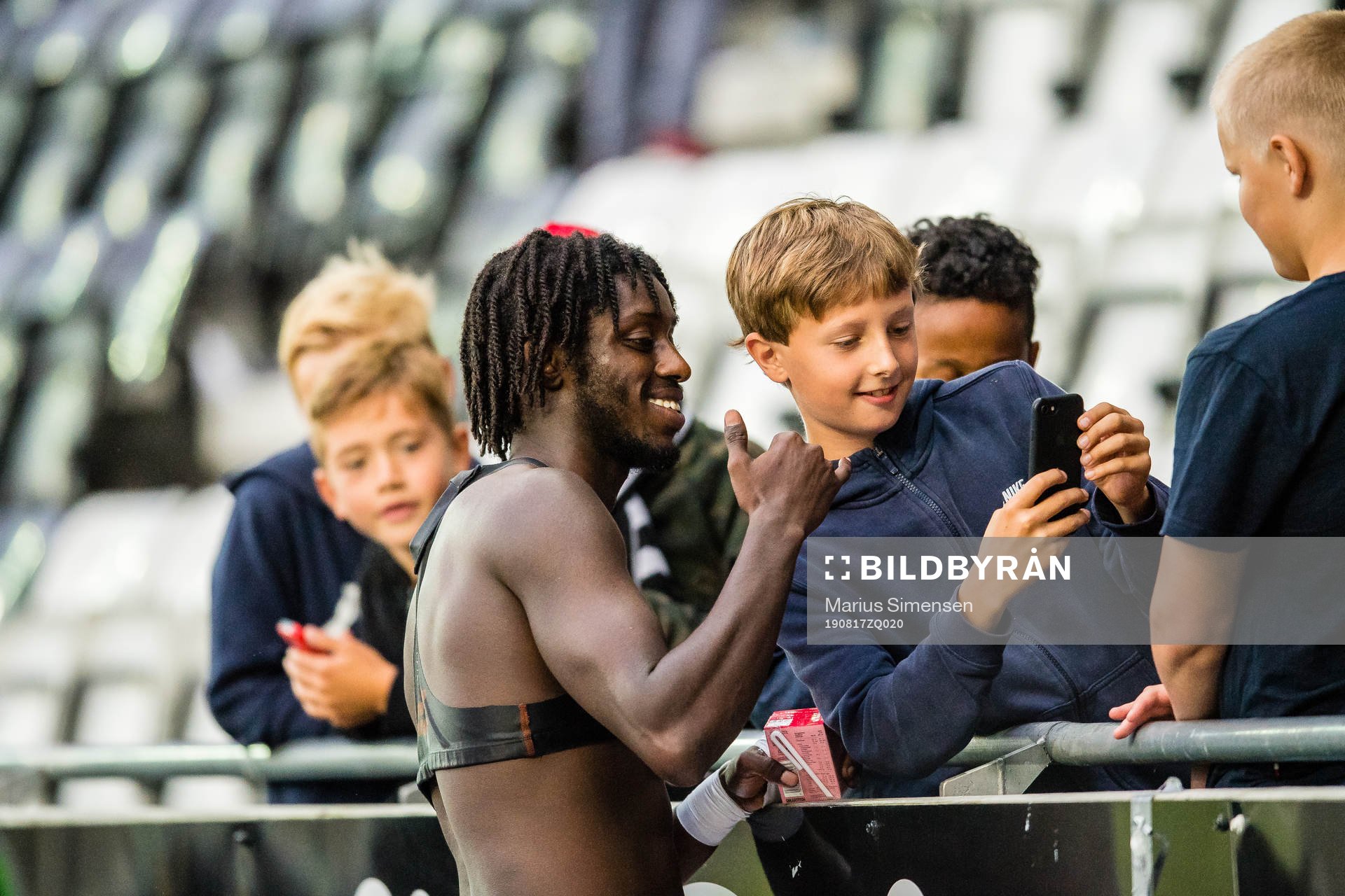 Moussa Jailani Gaucho Njie of Odd takes a selfie with a fan