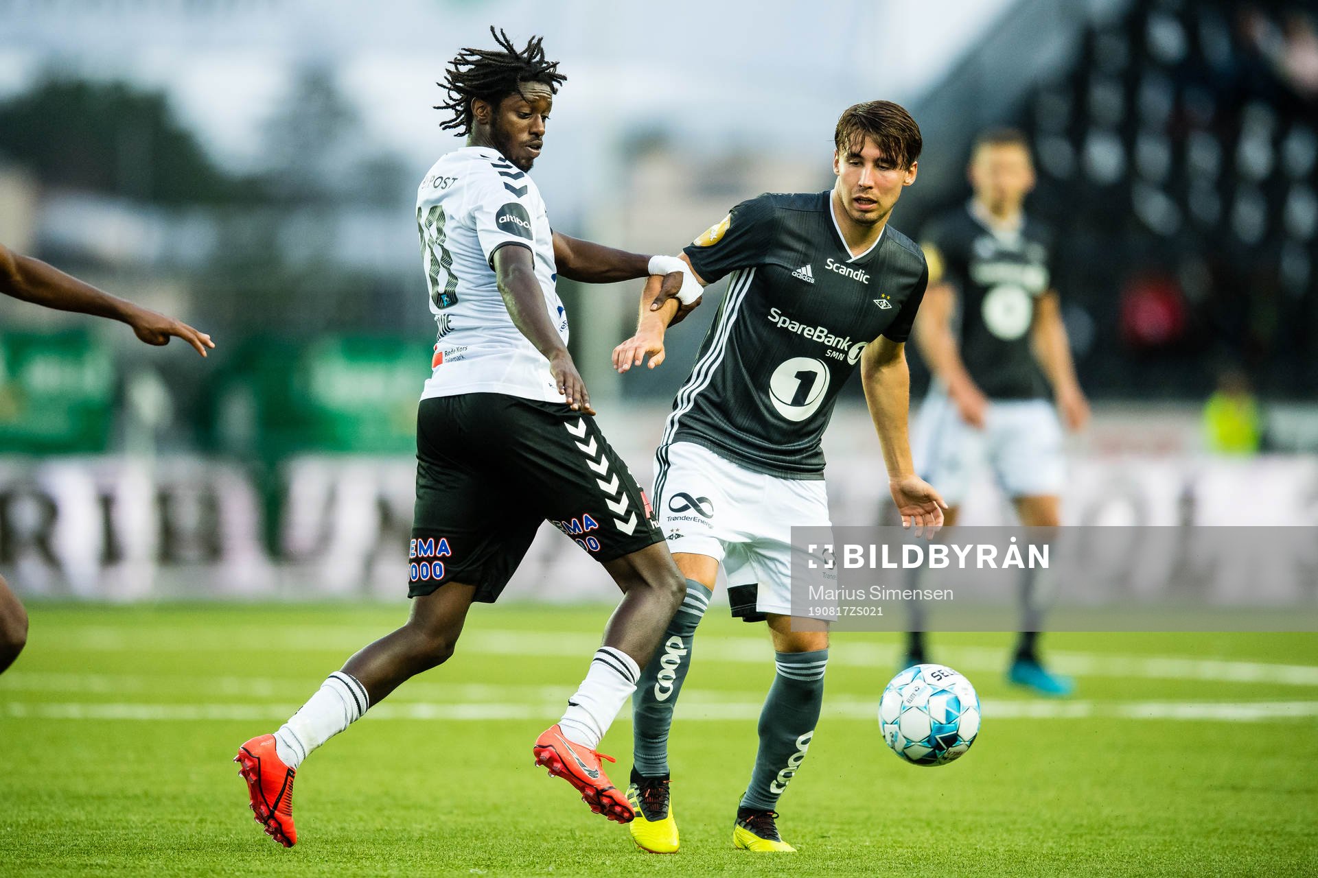 Moussa Jailani Gaucho Njie of Odd and Anders Trondsen of Rosenborg during the Eliteserien match between Odd and Rosenborg on August 17, 2019 in Skien.