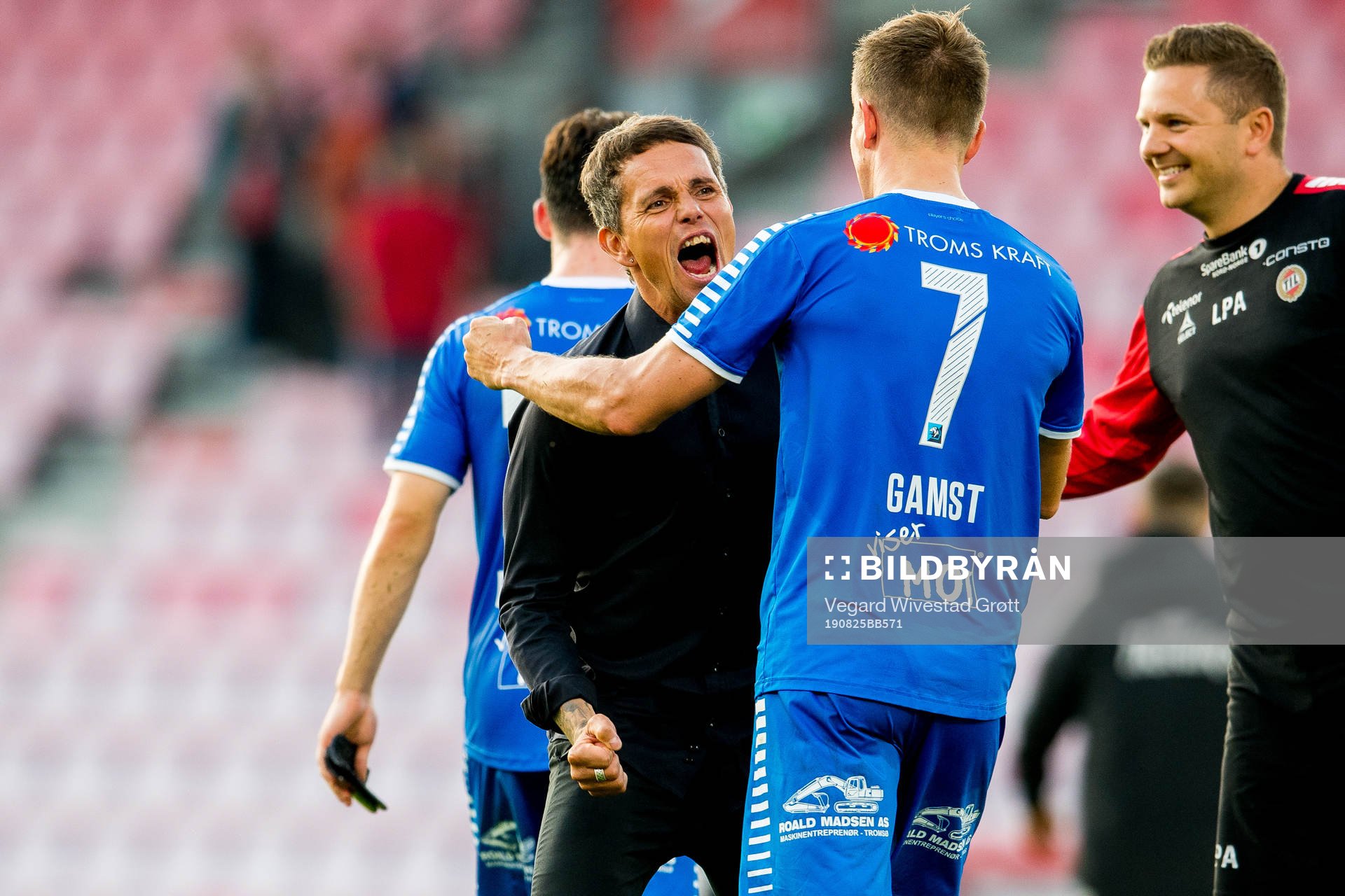 Simo Valakari, head coach of Tromsø, and Morten Gamst Pedersen celebrate after the Eliteserien football match between Brann and Tromsø on August 25, 2019 in Bergen.
