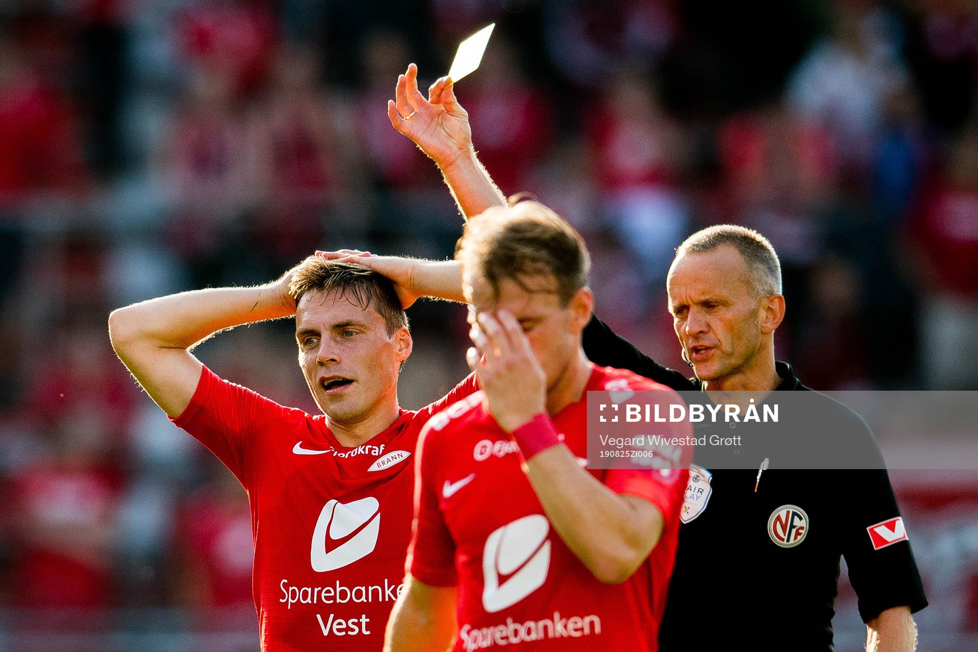 Ruben Yttergård Jenssen of Brann receives a yellow gard of