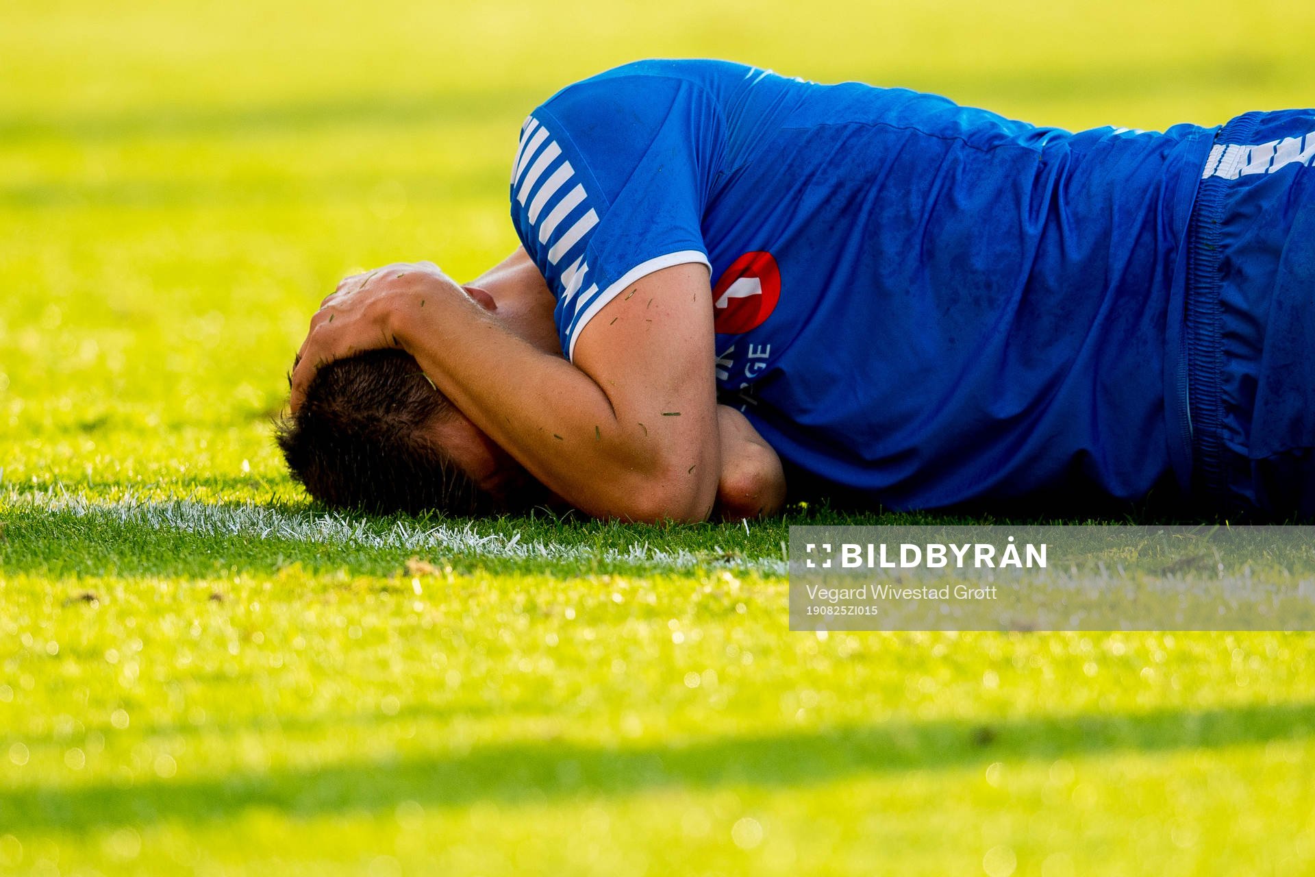 Jostein Gundersen of Tromsø lies down with an injury