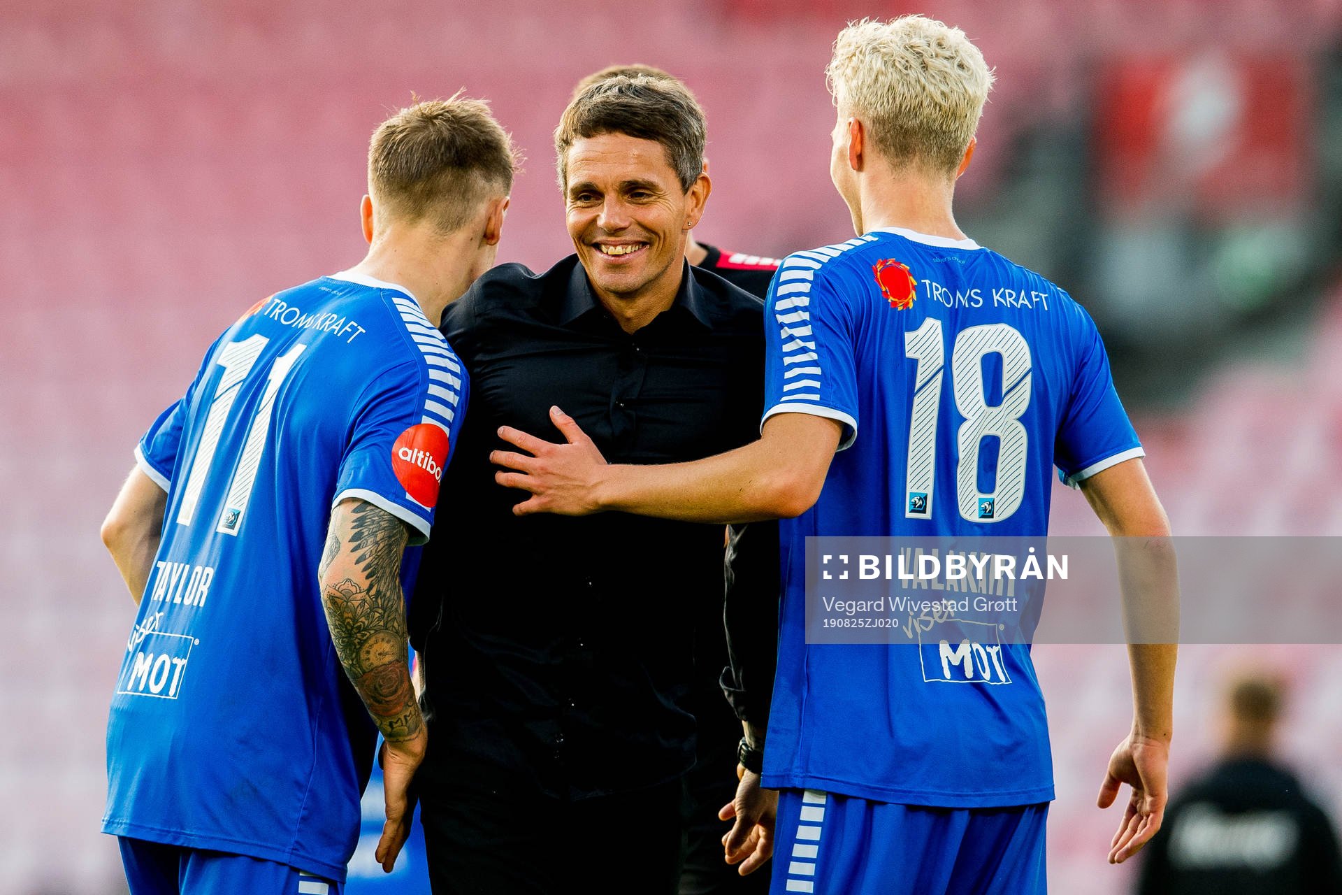 Simo Valakari, head coach of Tromsø, celebrates with Robert Taylor and Onni Valakari after the Eliteserien football match between Brann and Tromsø on August 25, 2019 in Bergen.