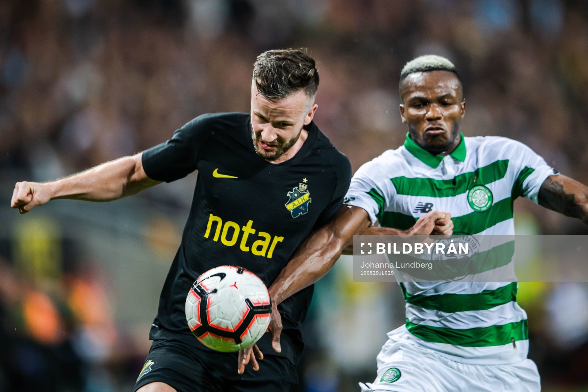 Robert Lundström of AIK and Boli Bolingoli of Celtic during the Europa League qualifying match between AIK and Celtic on August 29, 2019 in Stockholm.