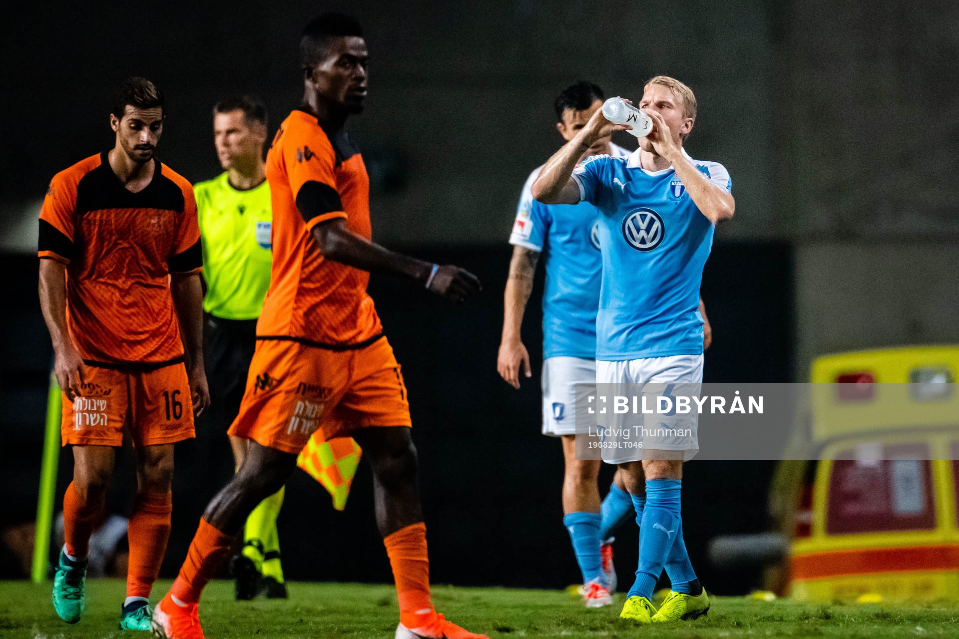 Players of Bnei Yehuda and Oscar Lewicki of Malmö FF