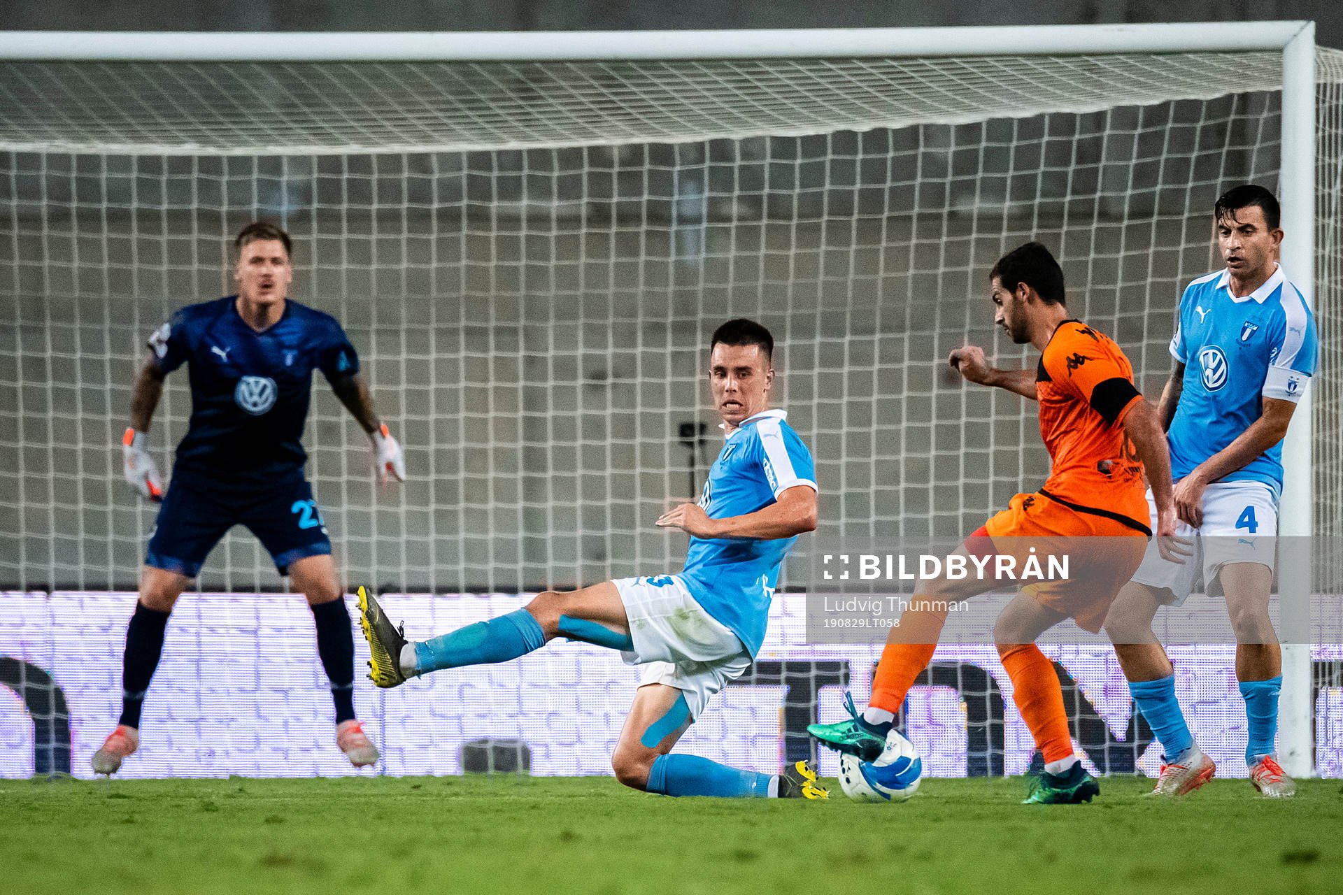 Avishay Cohen of Bnei Yehuda shoots at Jonas Knudsen and