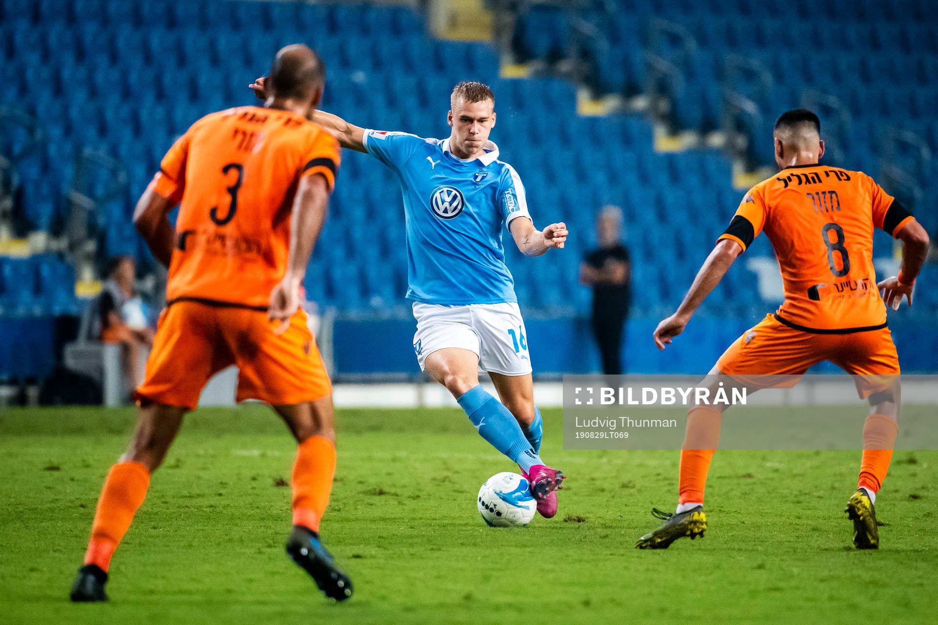 Felix Beijmo of Malmö FF in a duel with Din Mori and Shay