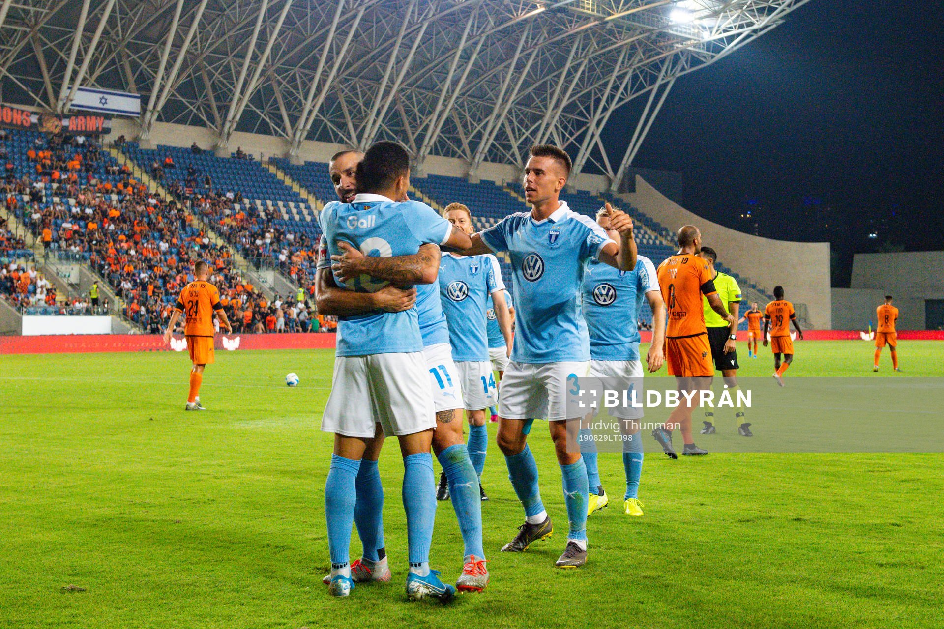 Guillermo Molins celebrates with Romain Gall and Jonas