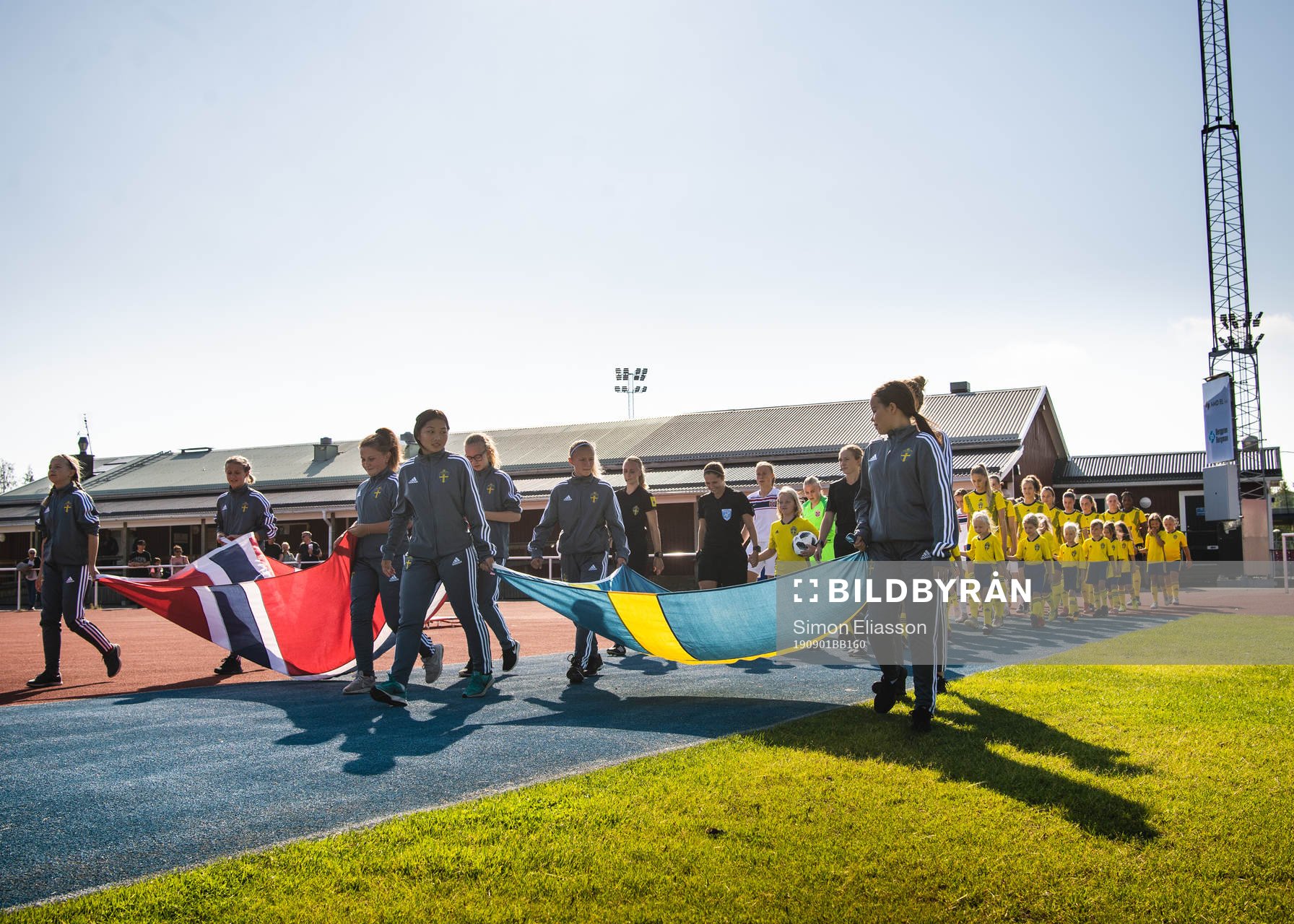 Team Sweden and Norway enter the field