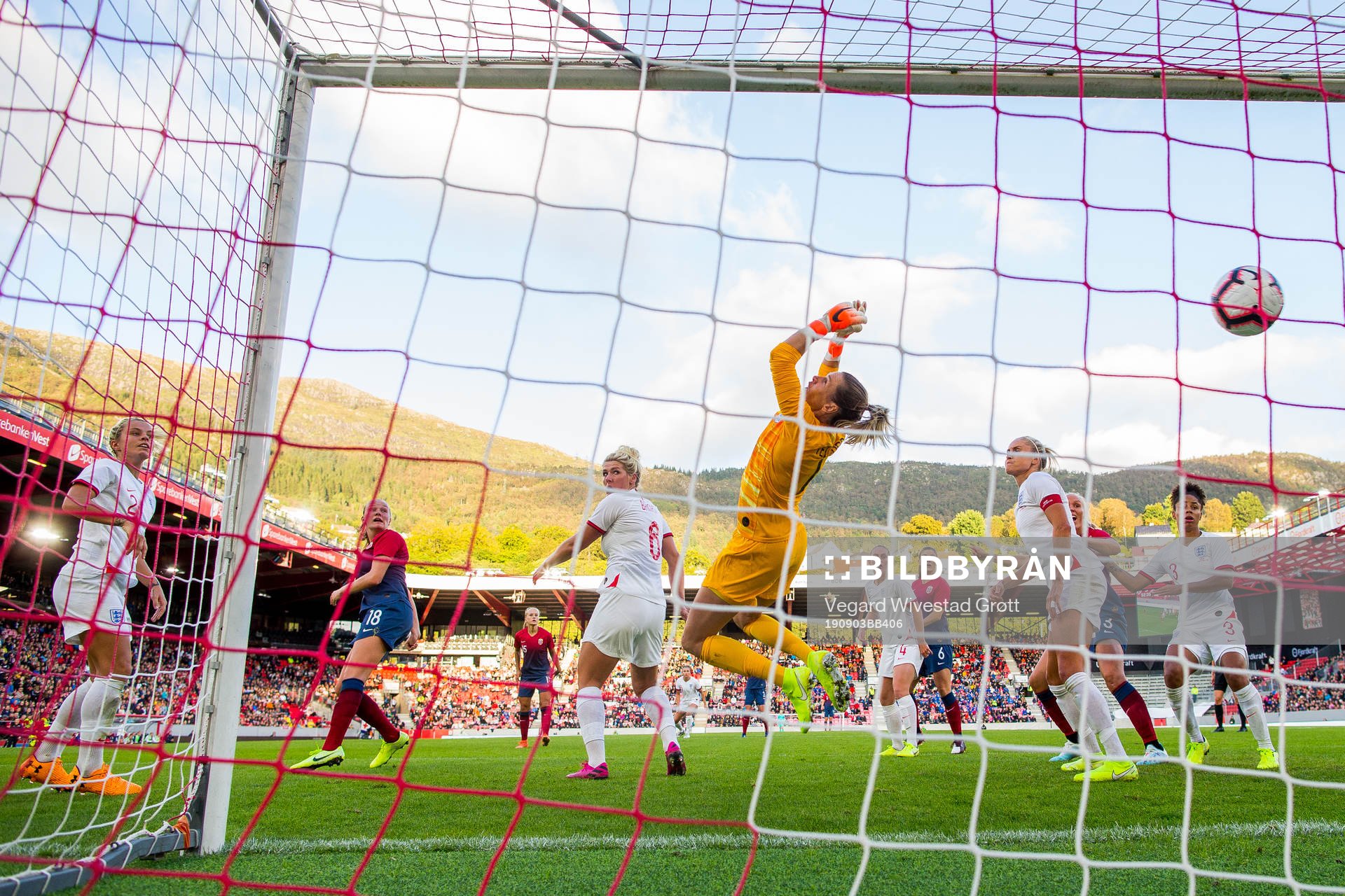 Frida Maanum of Norway scores 1-1 behind goalkeeper Carly