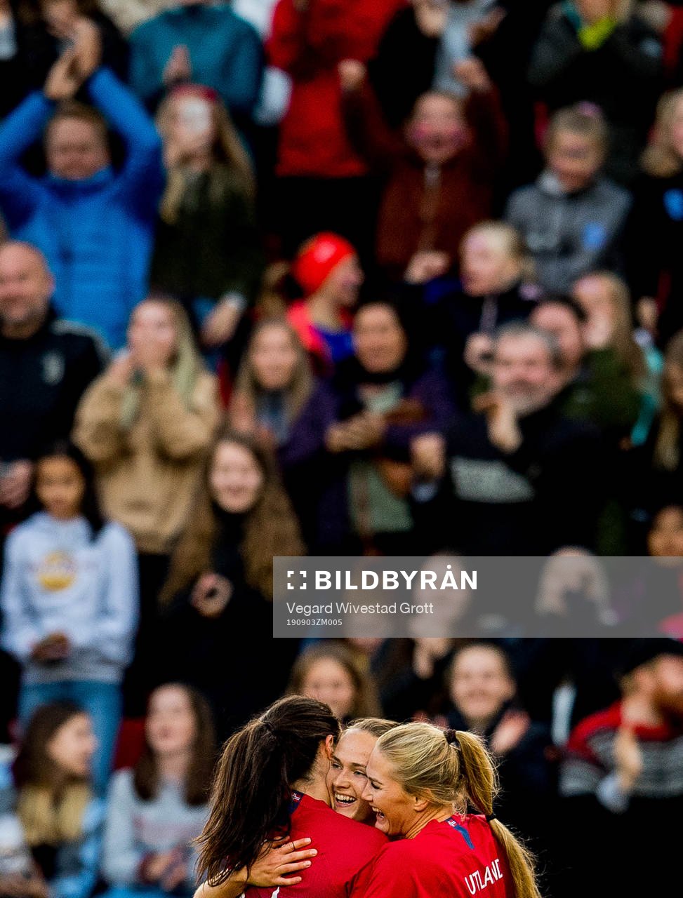 Caroline Graham Hansen of Norway celebrates with teammates Ingrid Syrstad Engen and Lisa-Marie Karlseng Utland after scoring 2-1 during the women's international friendly football match between Norway and England on September 3, 2019 in Bergen.