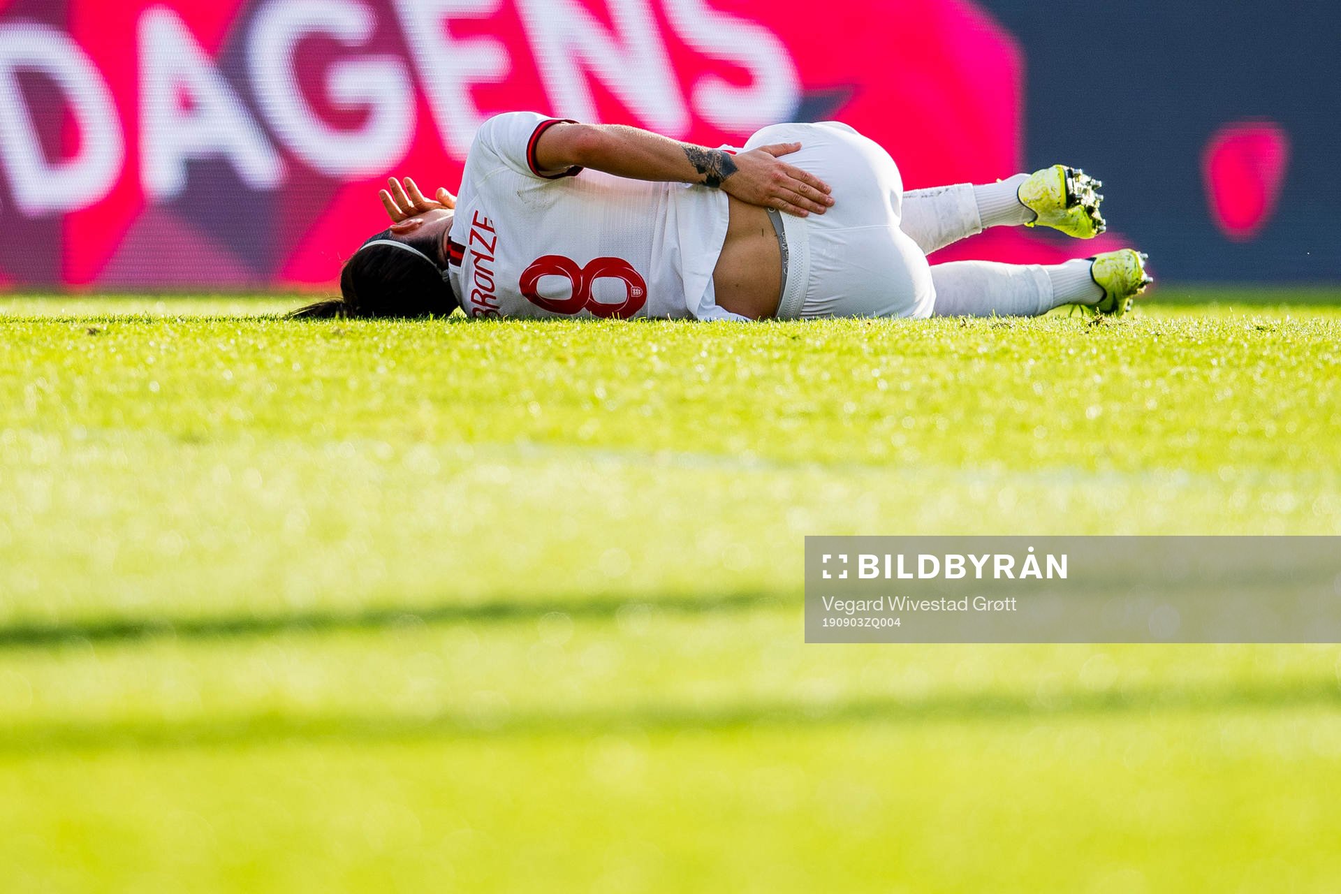 Lucy Bronze of England lies down with an injury