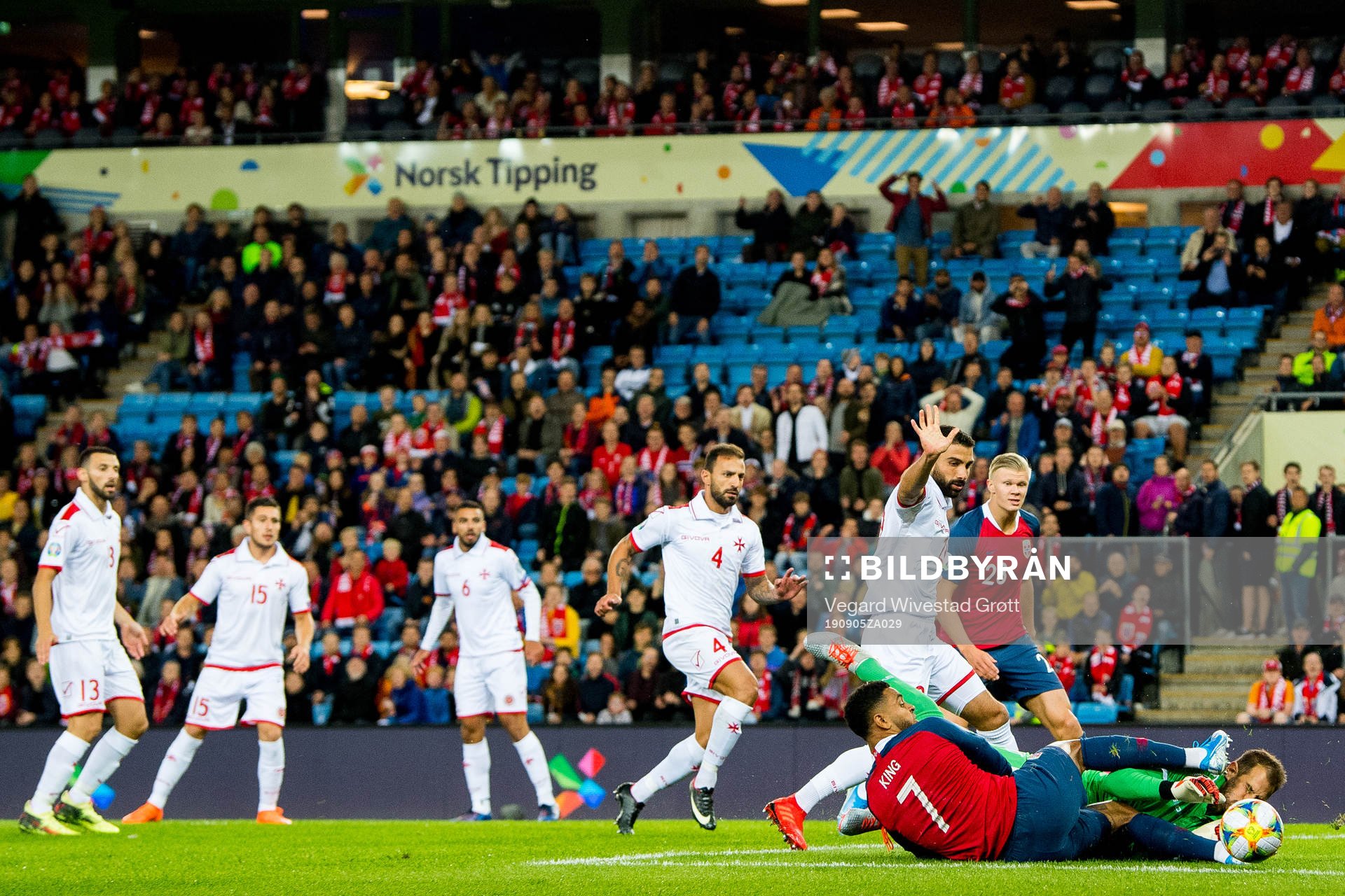 Joshua King of Norway and goalkeeper Henry Bonello of Malta