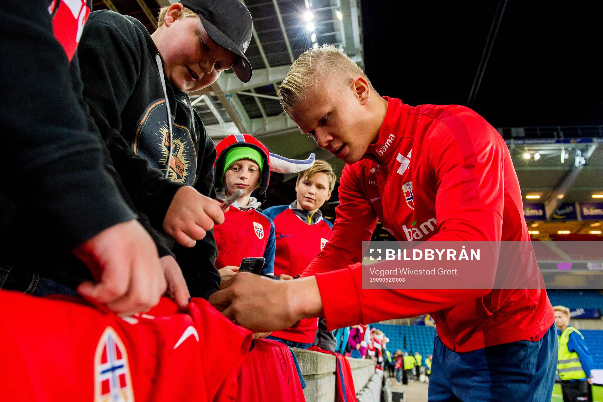 Erling Braut Haaland of Norway signs autographs
