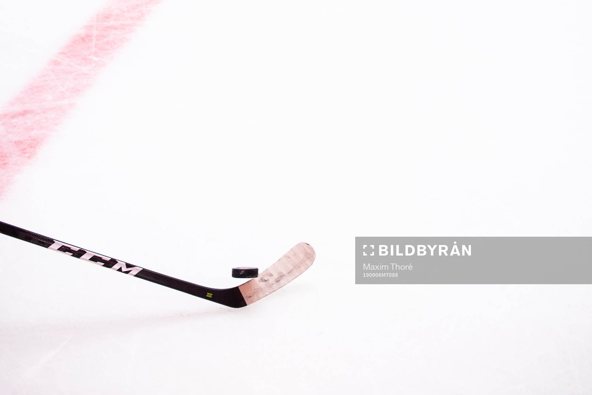 A general picture of a hockey stick and a puck