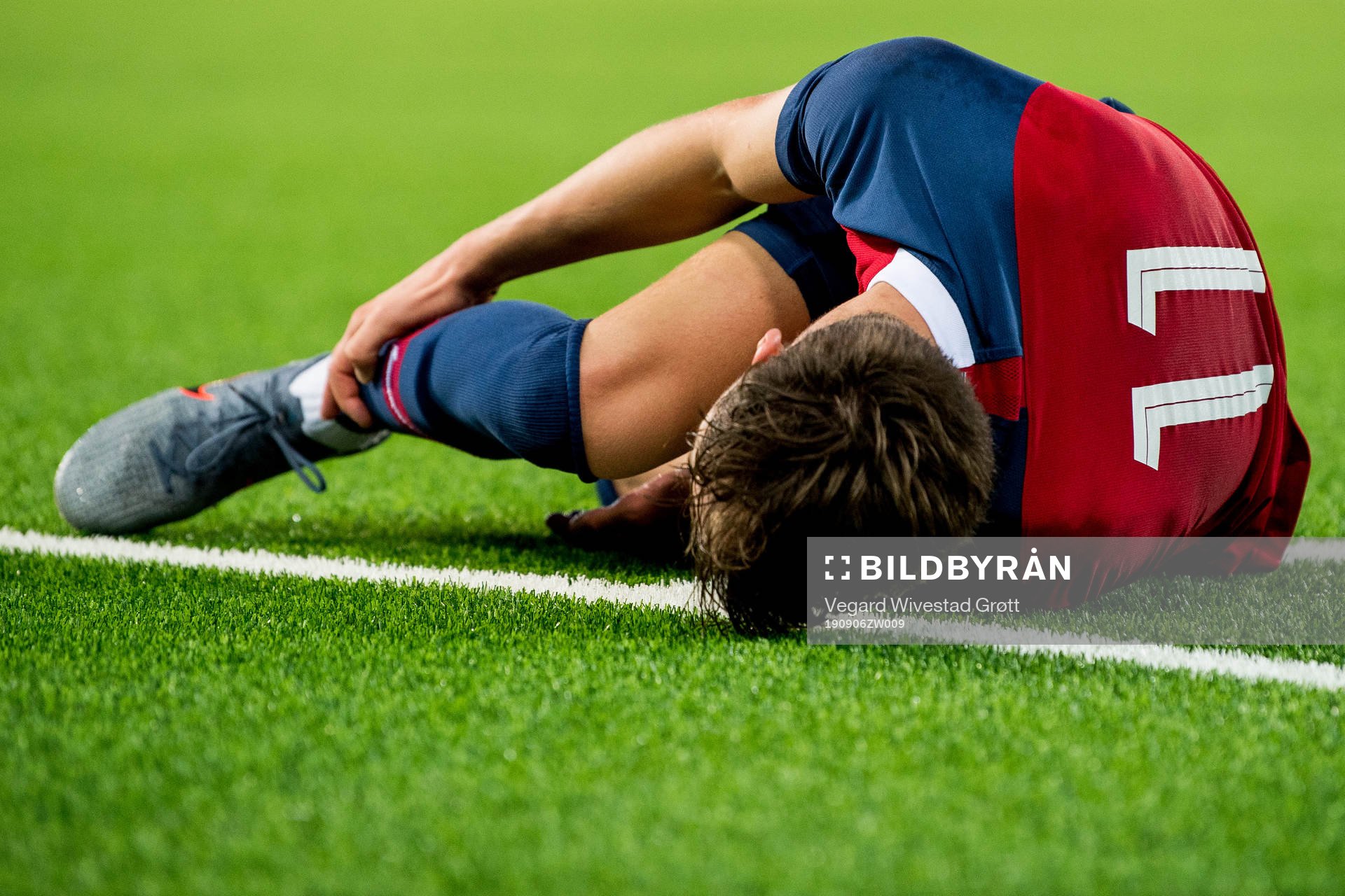 Håkon Evjen of Norway lies down with an injury
