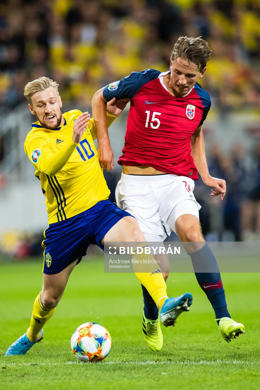 Emil Forsberg of Sweden and Sander Berge of Norway compete