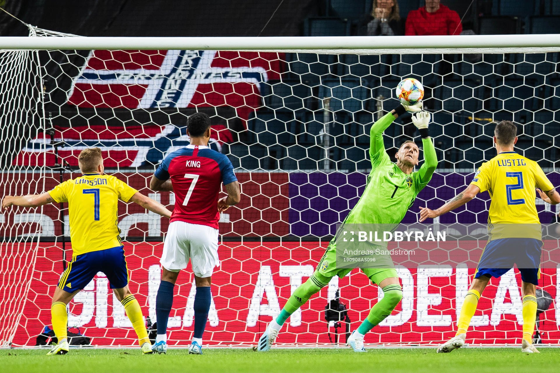 Goalkeeper Robin Olsen of Sweden saves a header from Joshua