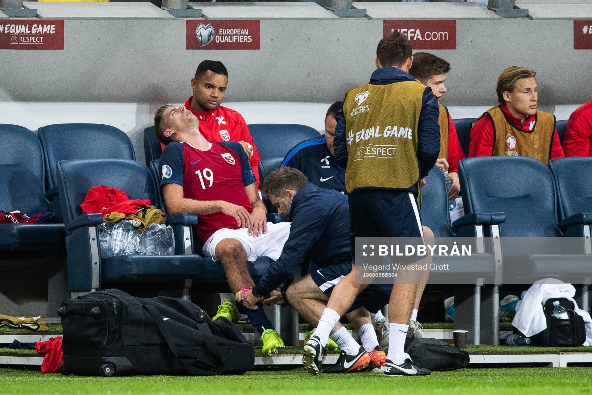 Markus Henriksen of Norway gets medical attention due to