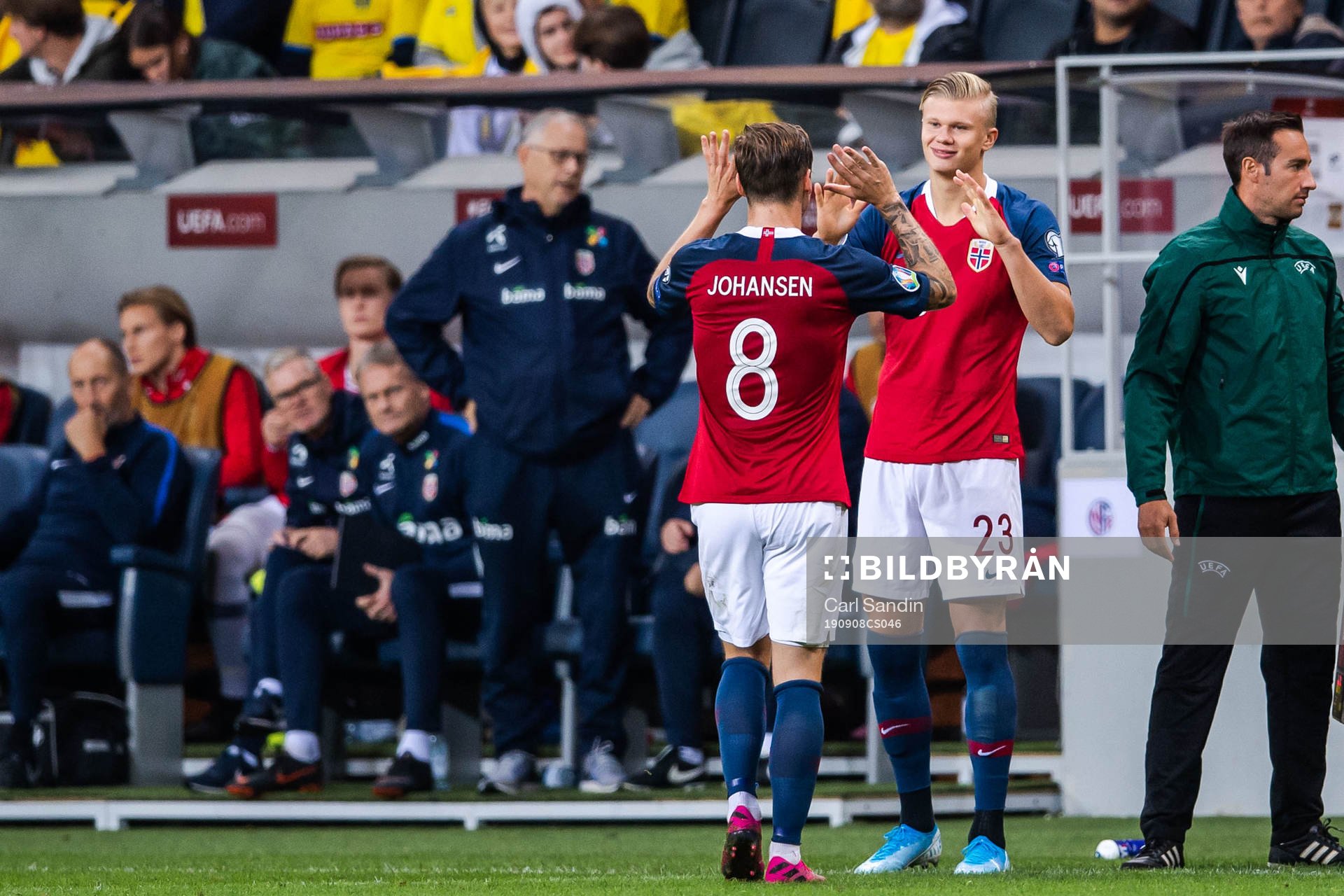 Stefan Johansen changes with Erling Braut Haaland of Norway