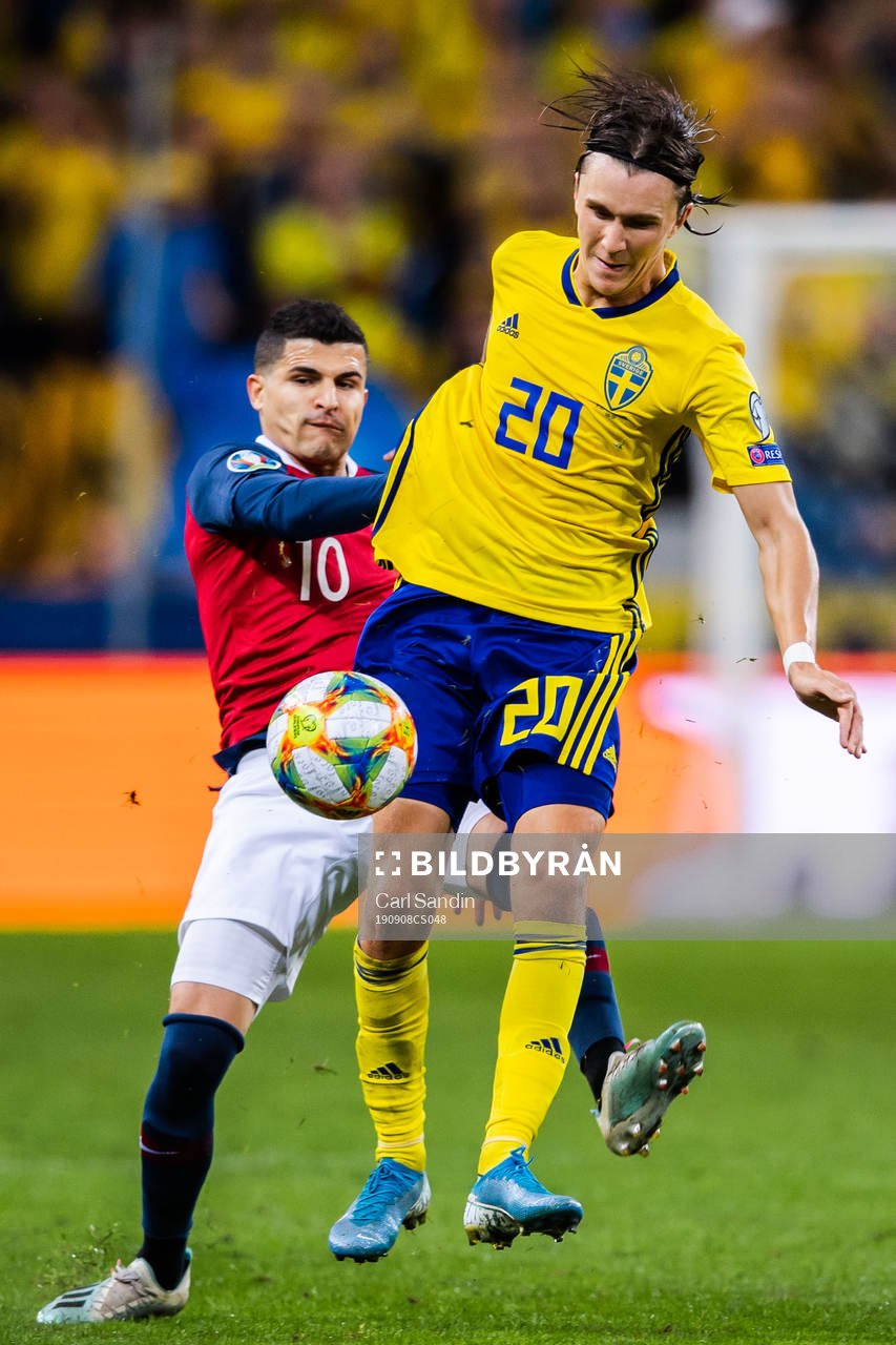 Tarik Elyounoussi of Norway and Kristoffer Olsson of Sweden