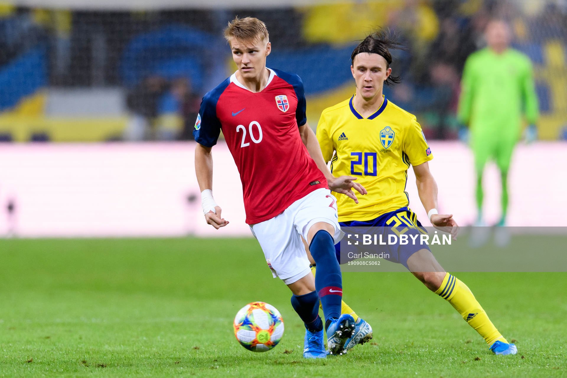 Martin Ødegaard of Norway and Kristoffer Olsson of Sweden