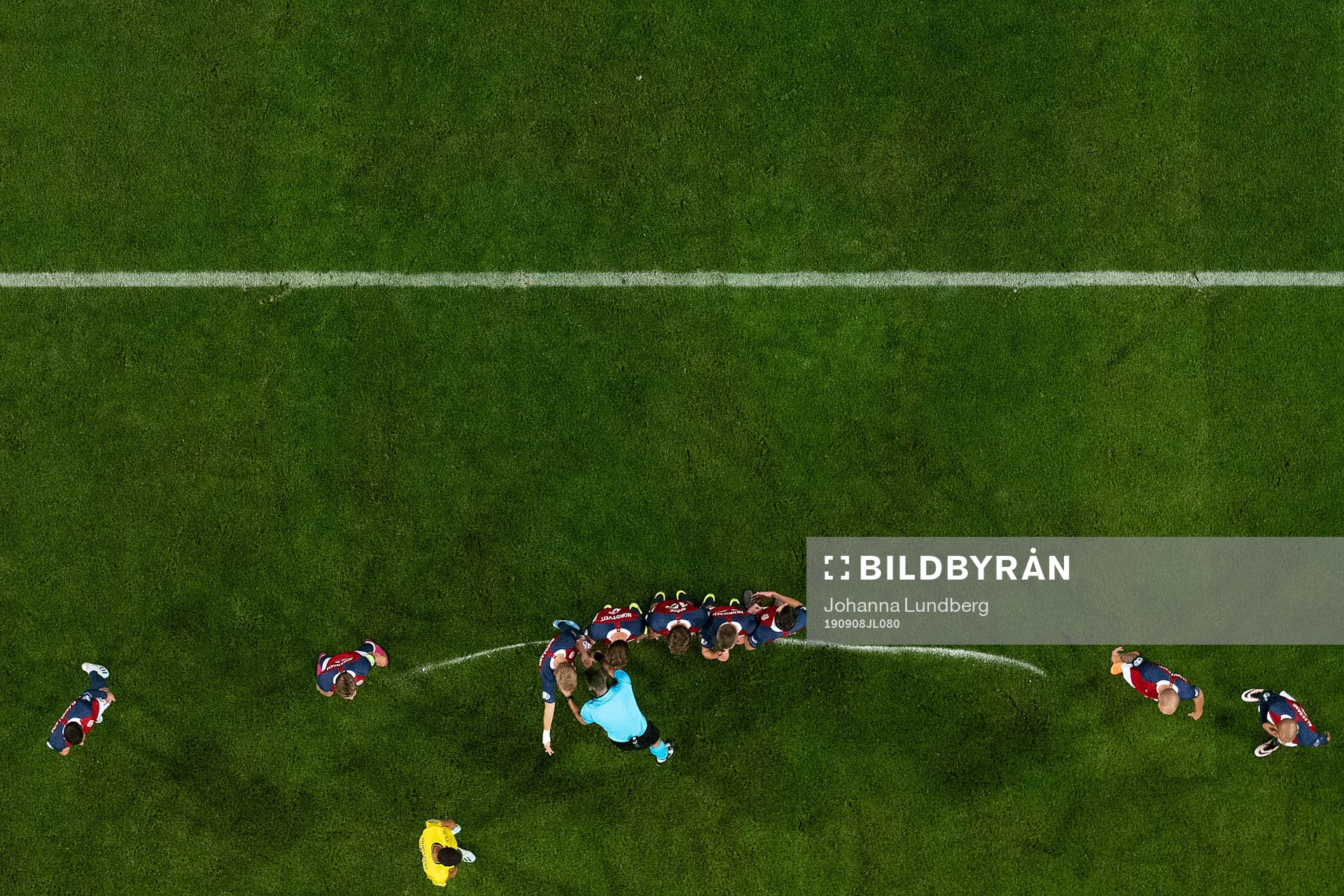 referee Slavko Vincic marks the free kick line