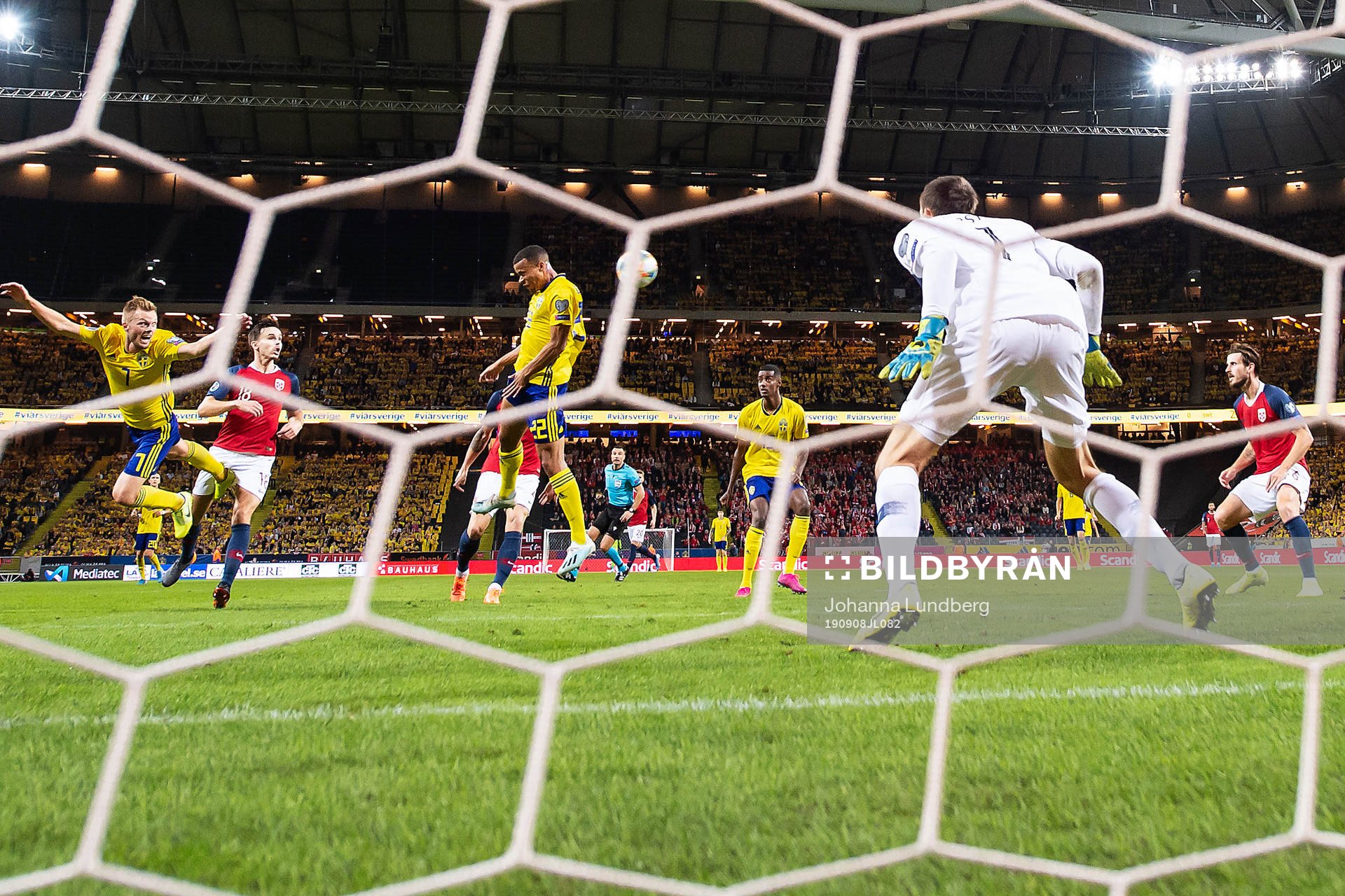 Robin Quaison of Sweden with a header
