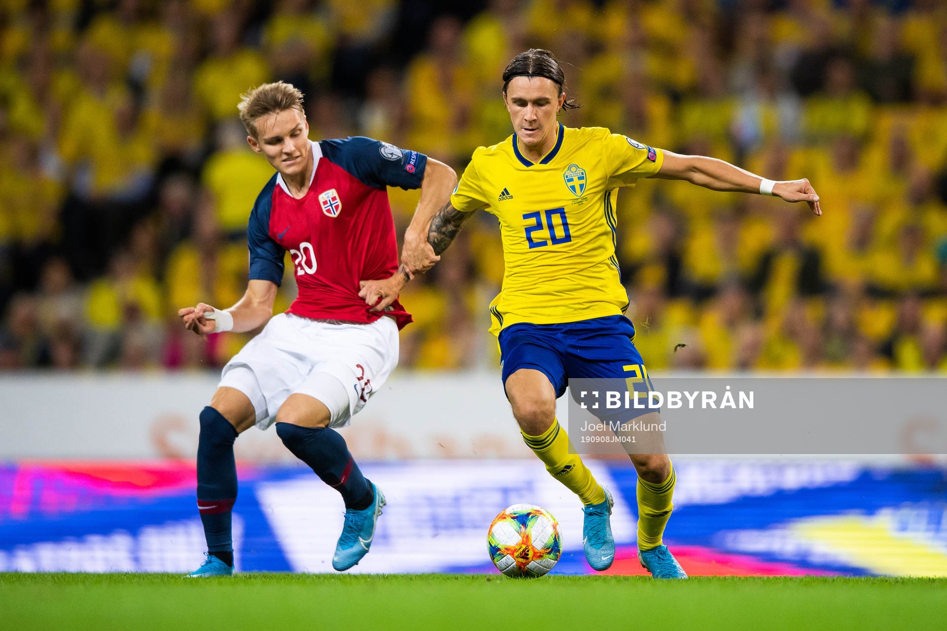 Martin Ødegaard of Norway and Kristoffer Olsson of Sweden