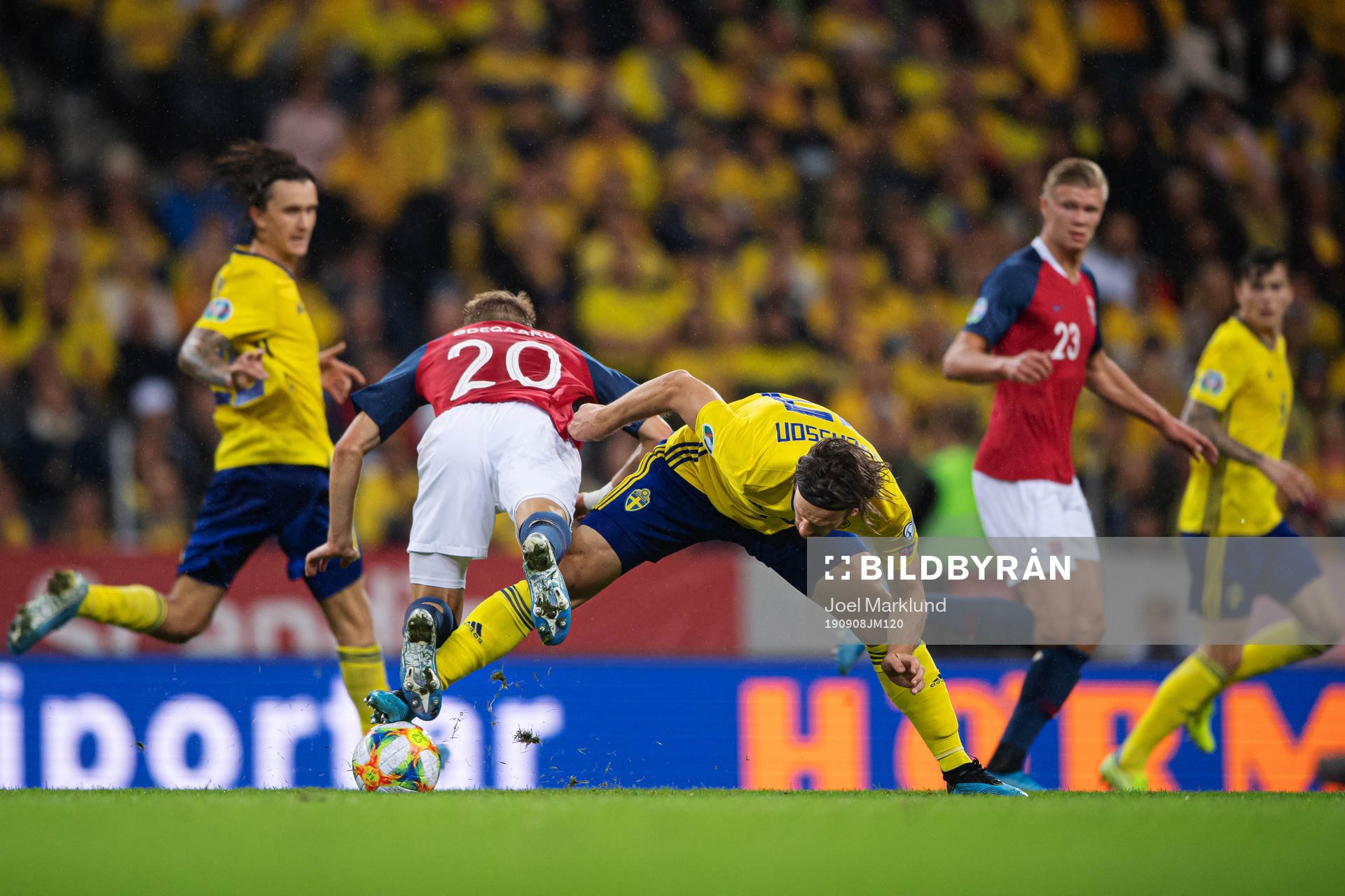 Martin Ødegaard of Norway is being tripped by Gustav