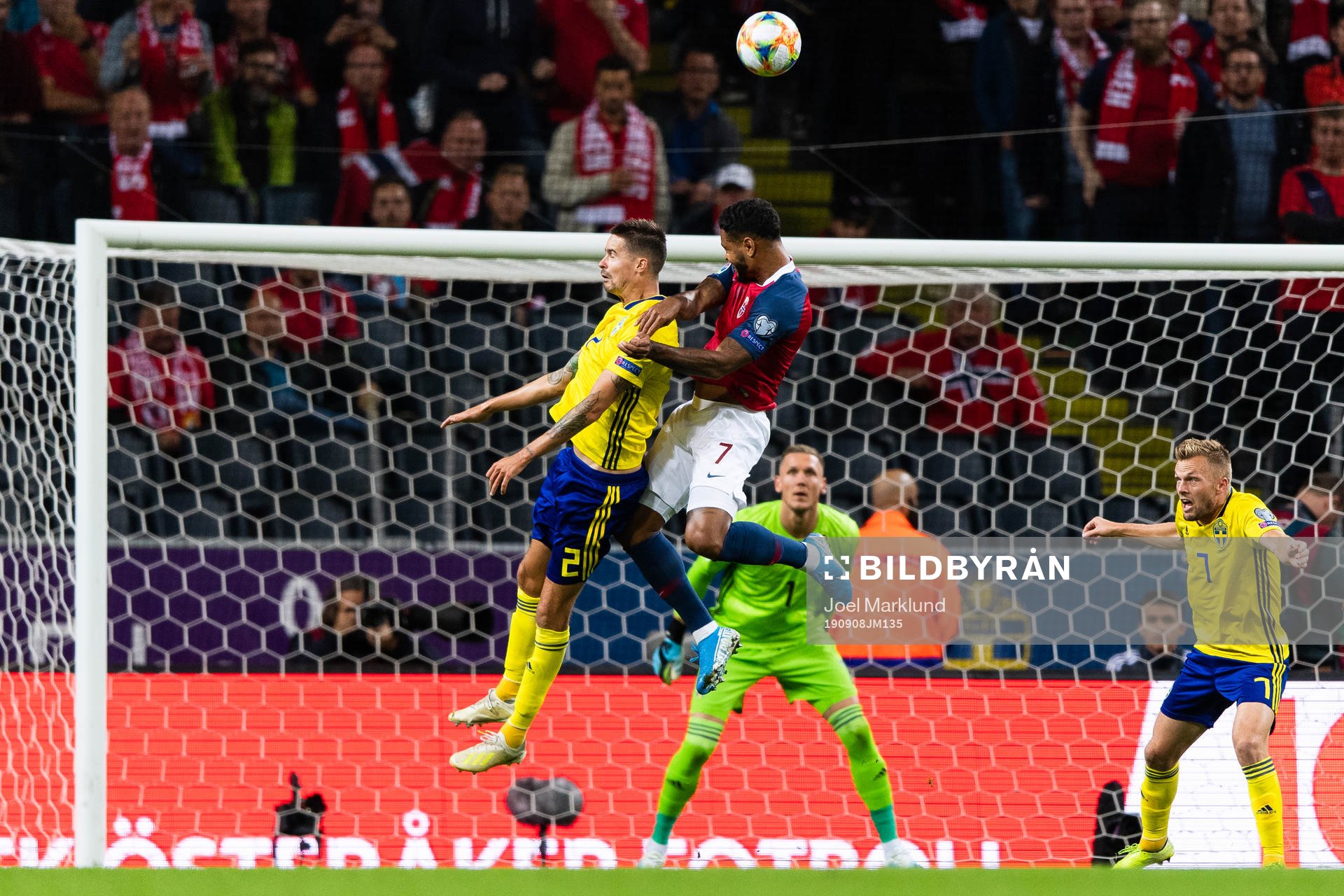 Mikael Lustig of Sweden and of Norway Joshua King compete