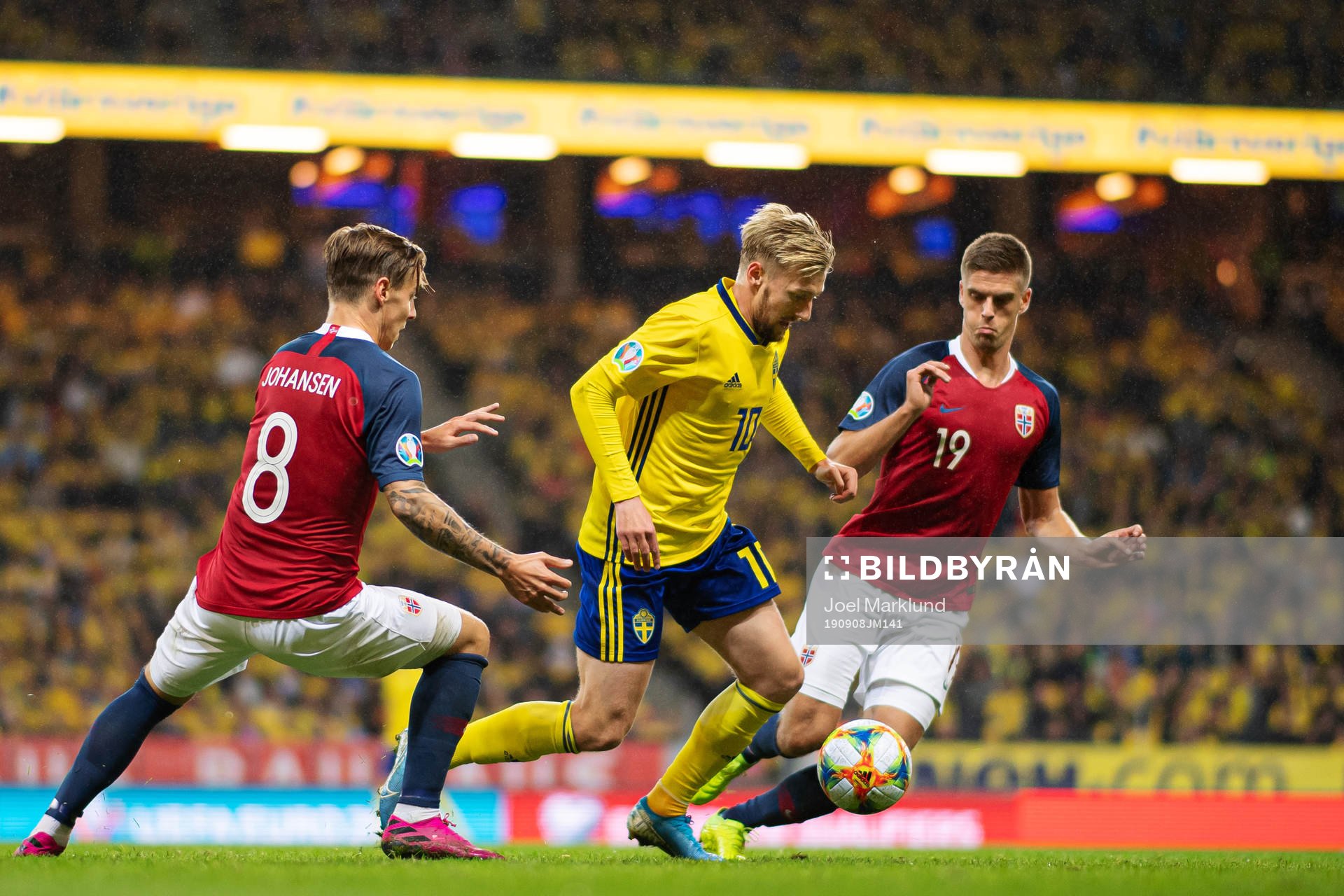 Stefan Johansen and Markus Henriksen of Norway are being