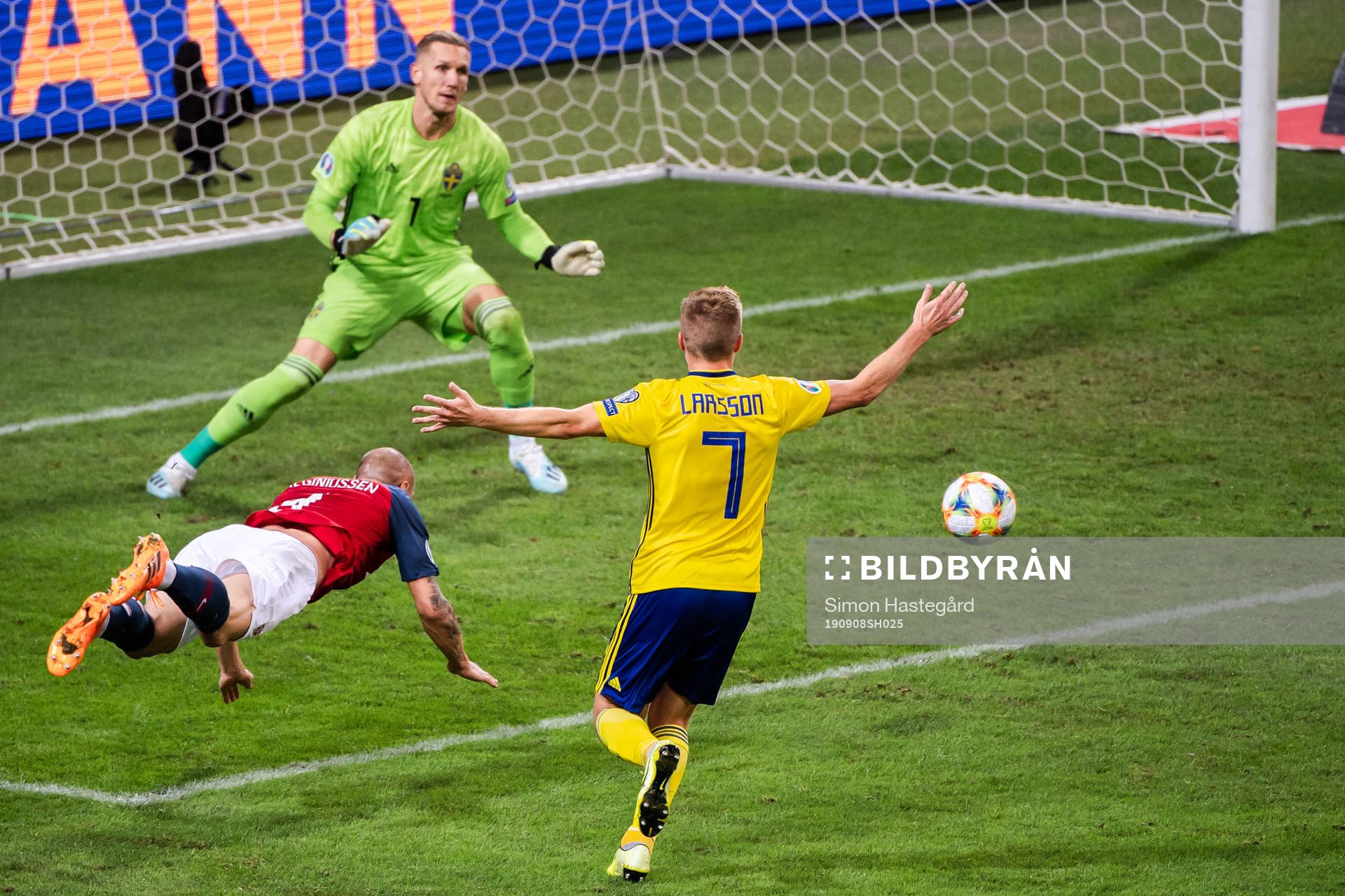 Tore Reginiussen of Norway against goalkeeper Robin Olsen