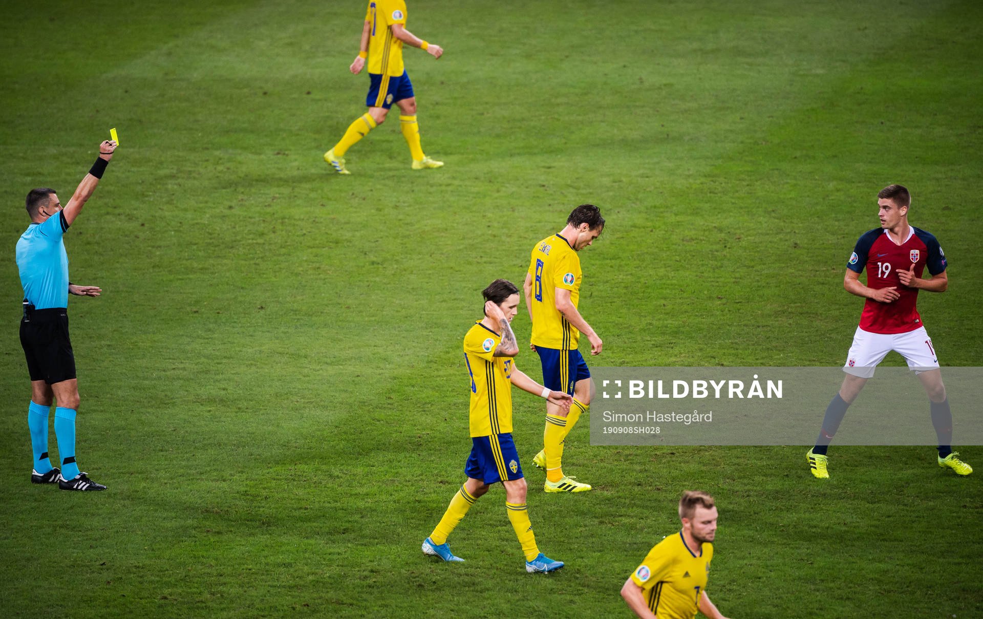 Markus Henriksen of Norway receives a varning from referee