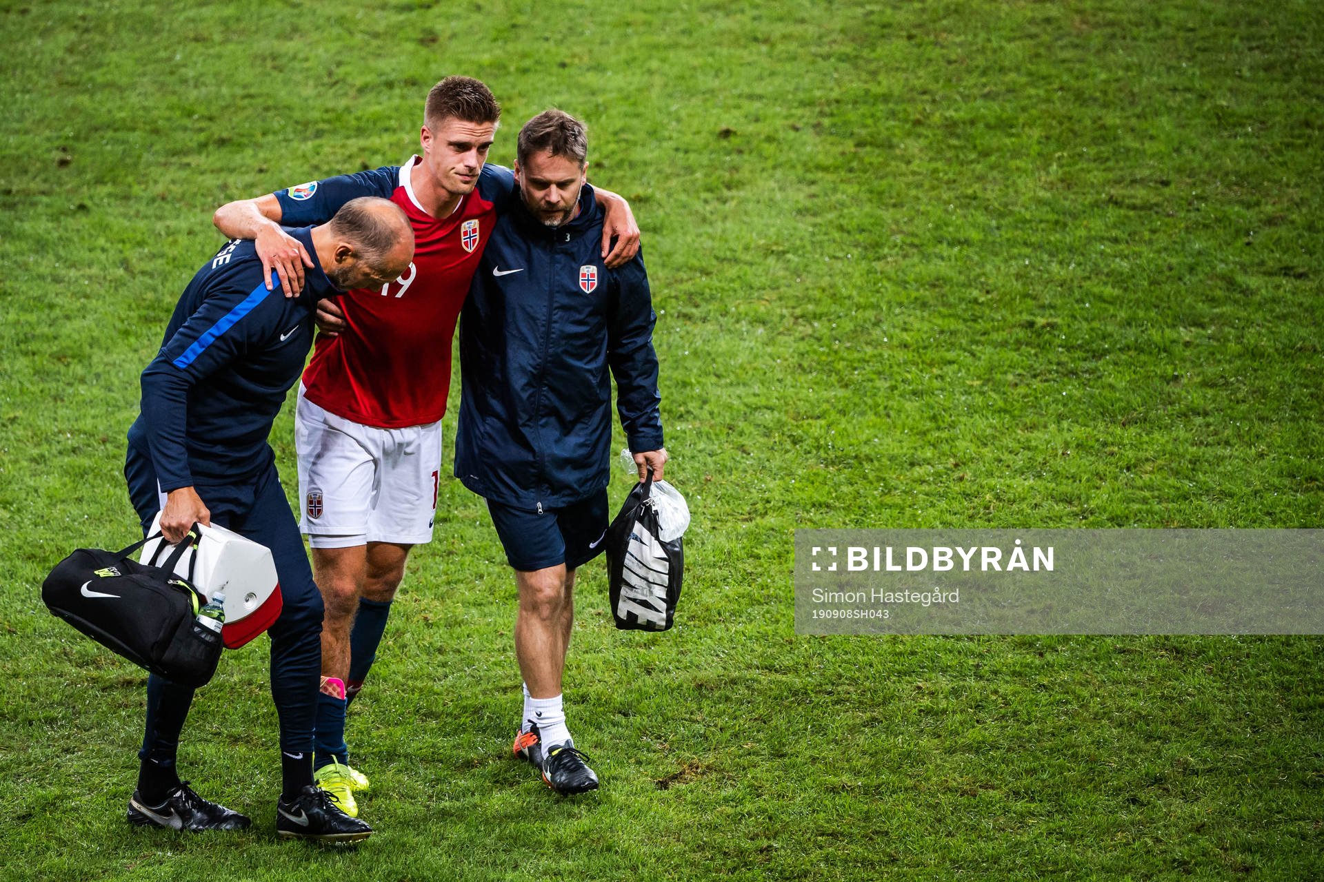 Markus Henriksen of Norway receives help of the pitch