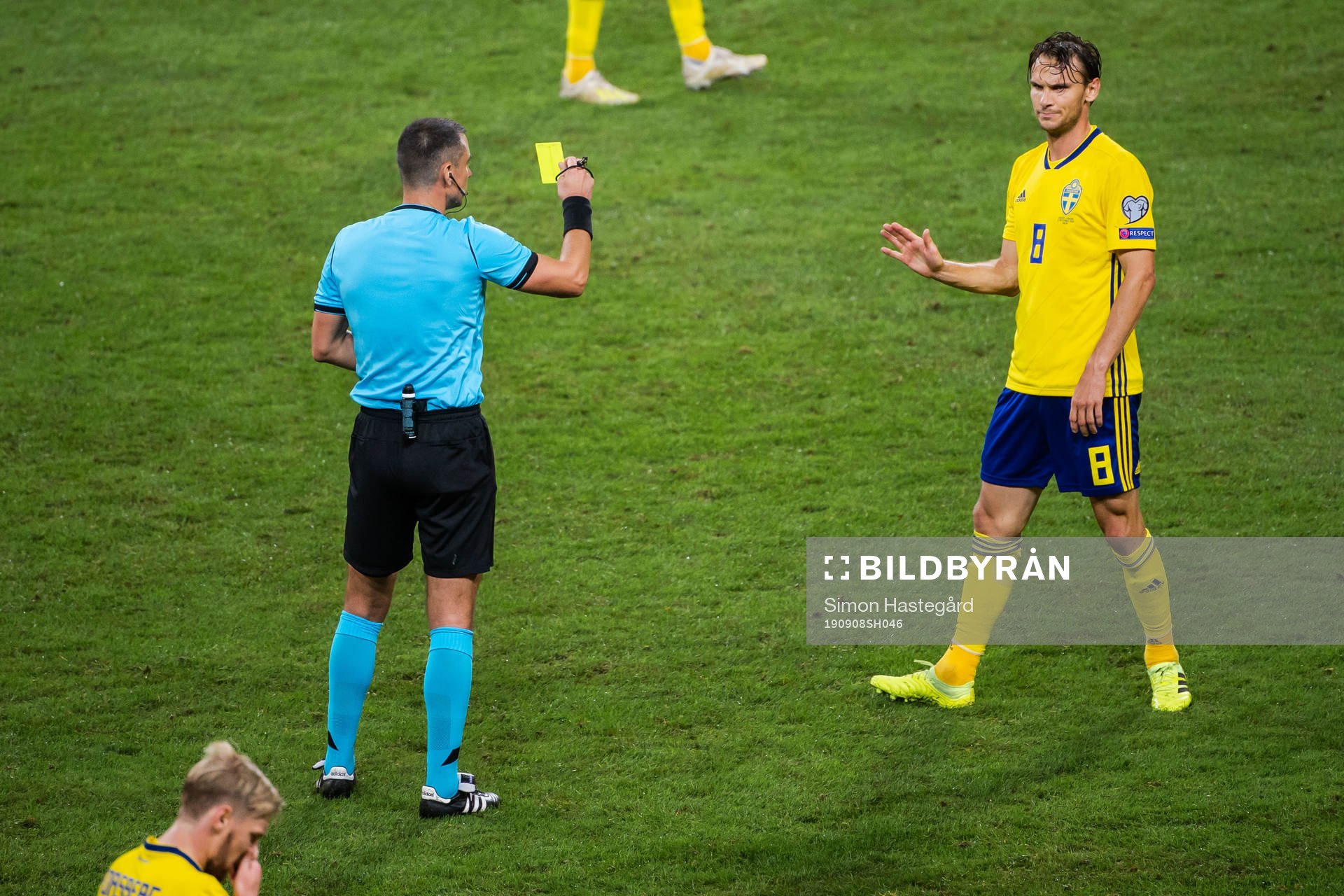 Albin Ekdal of Sweden receives a varning from referee
